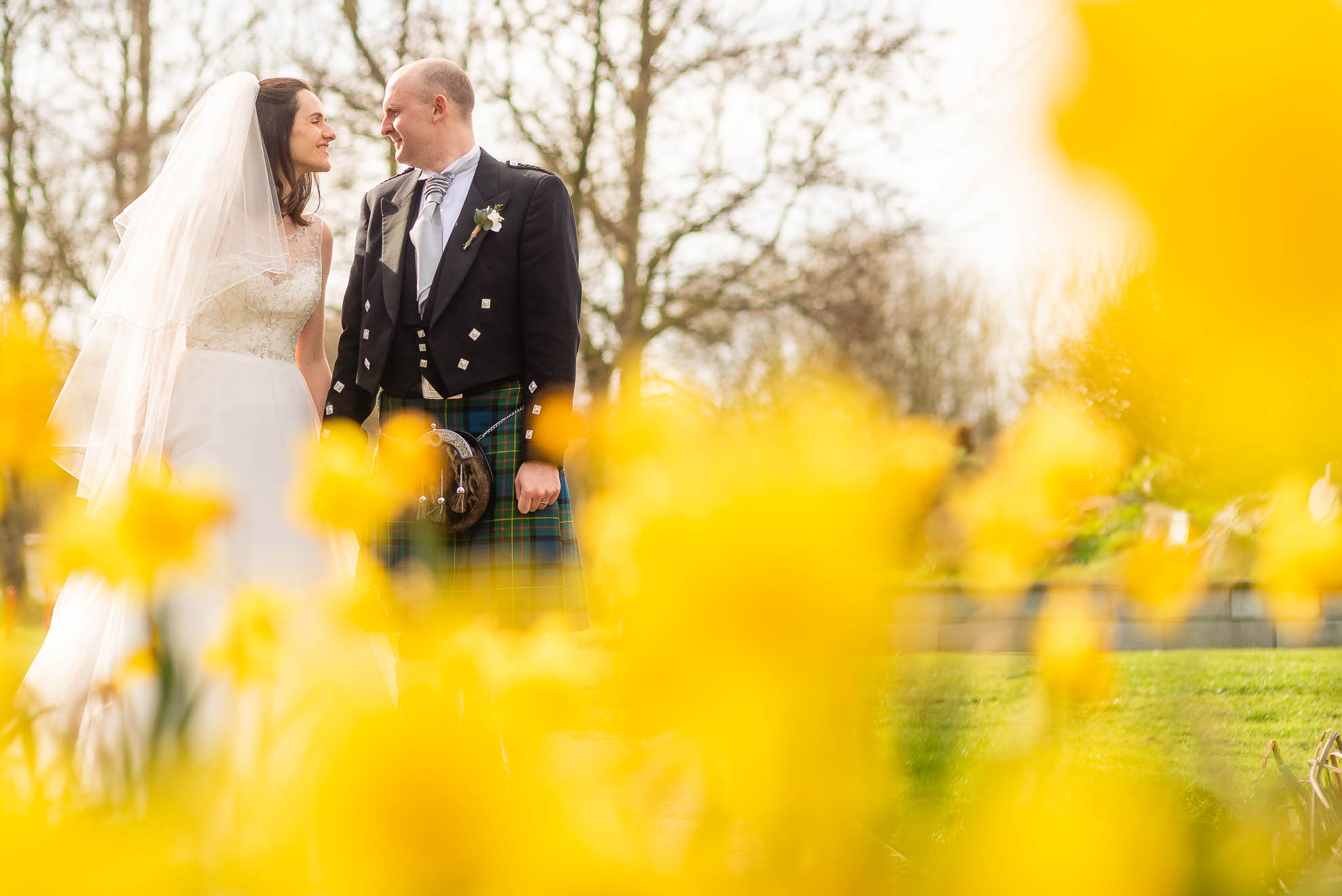 Bride and groom smile at each other