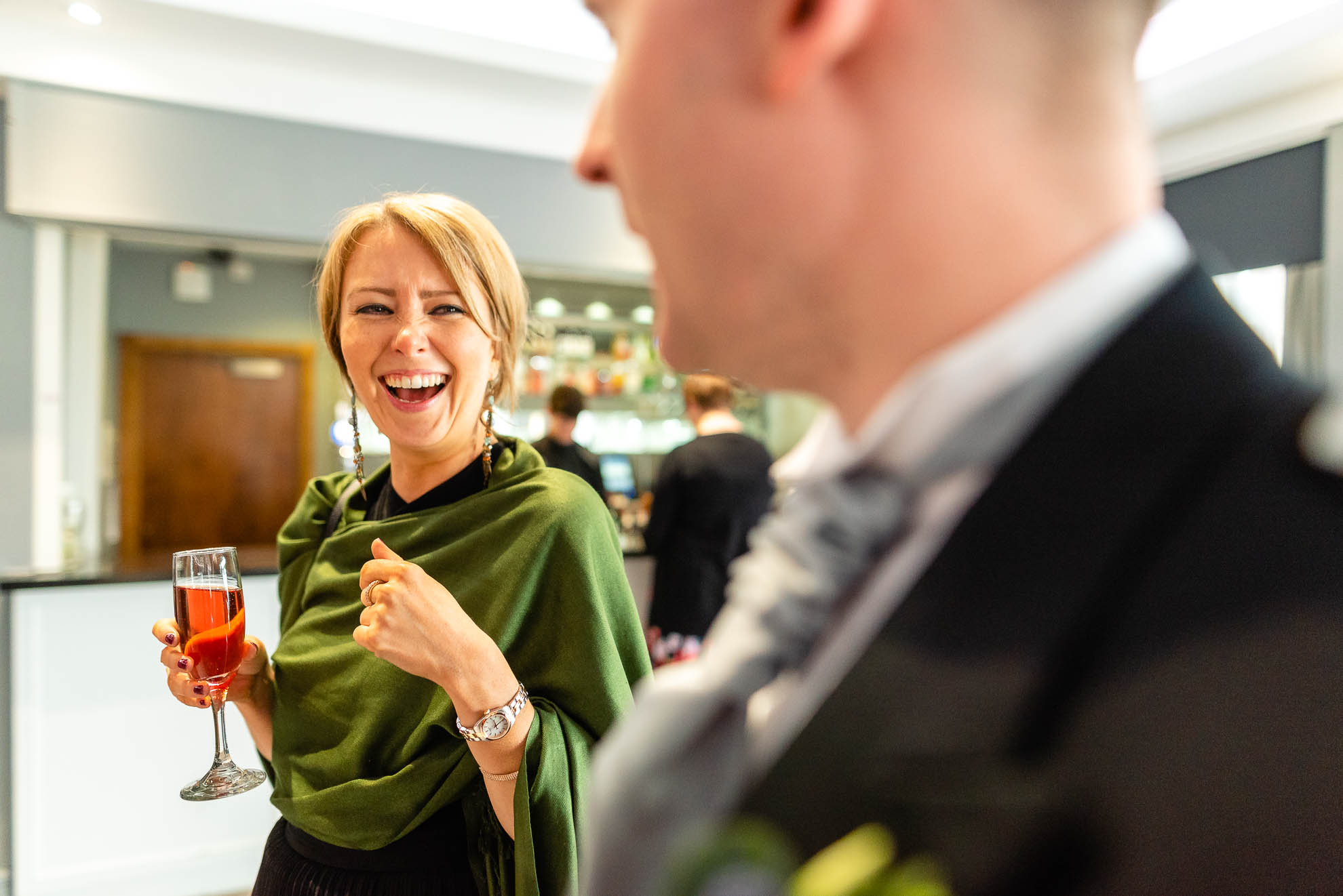 Guest shares a joke with groom