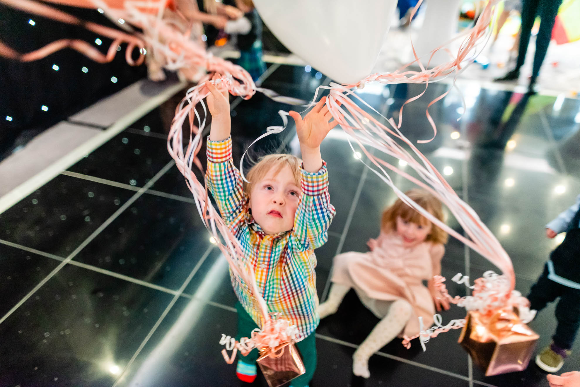 Little boy playing with balloons