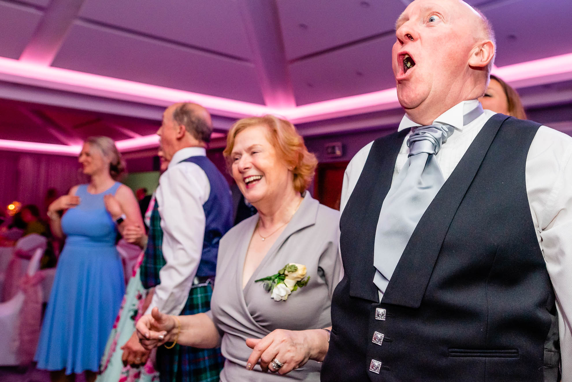Mother and father of the groom enjoying the line dancing