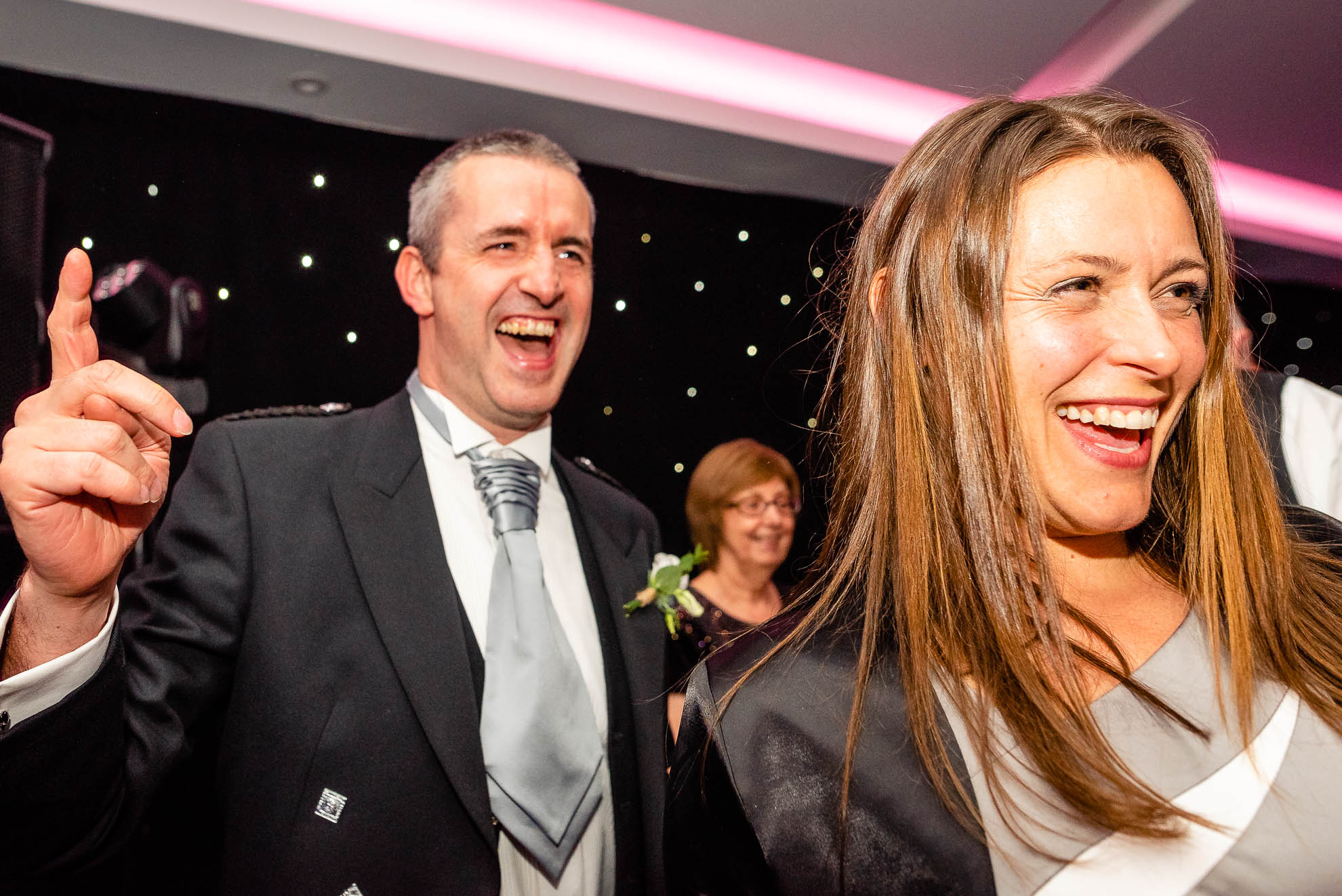 Best man and partner enjoying the line dancing
