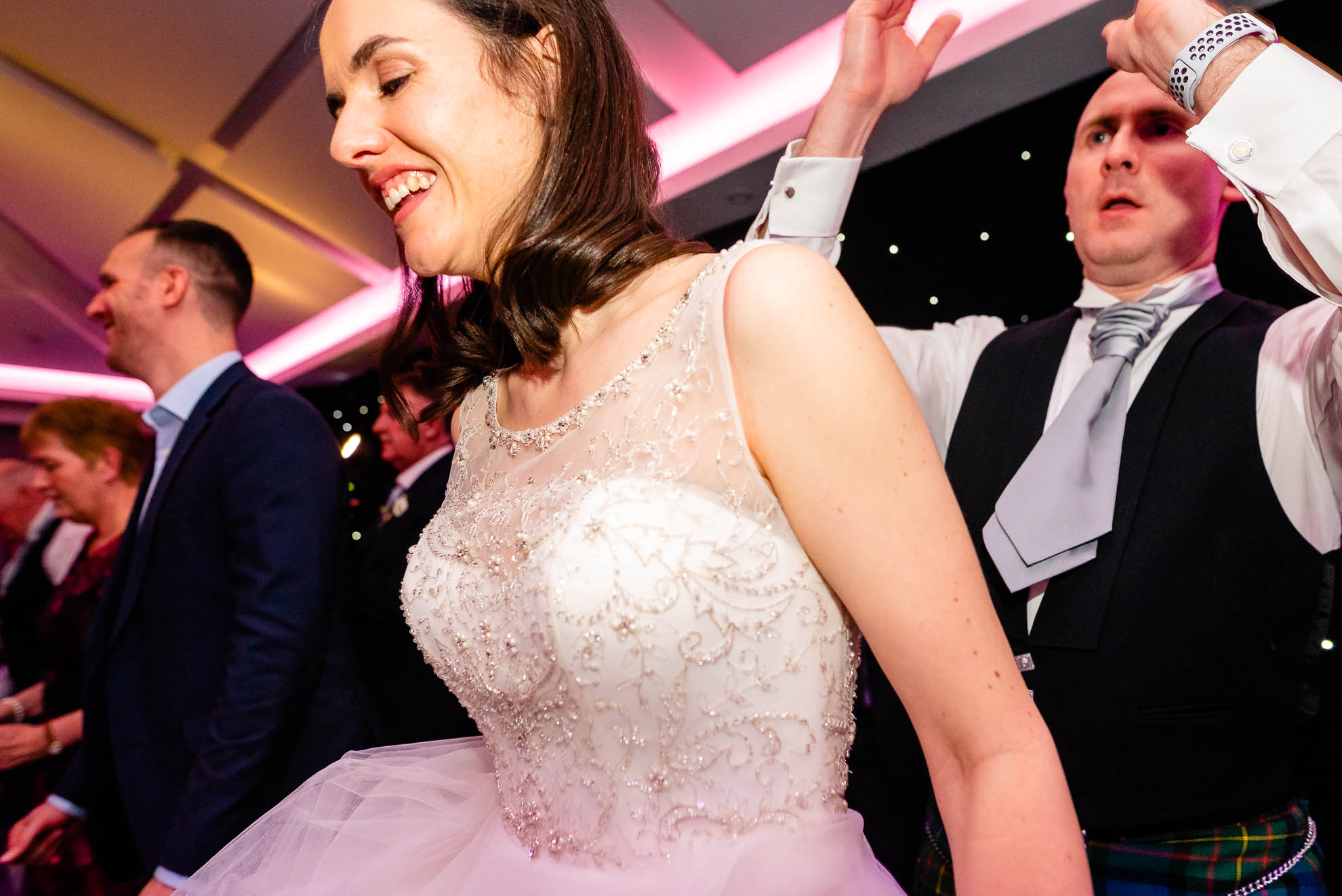 Bride and groom enjoying the line dancing