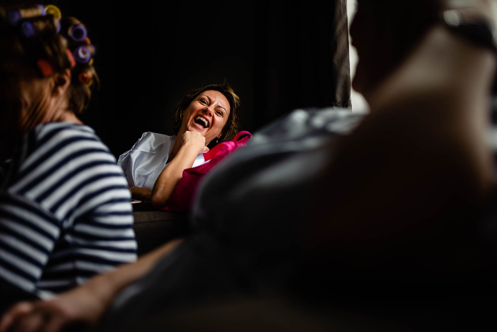 Bride shares a joke with bridesmaid