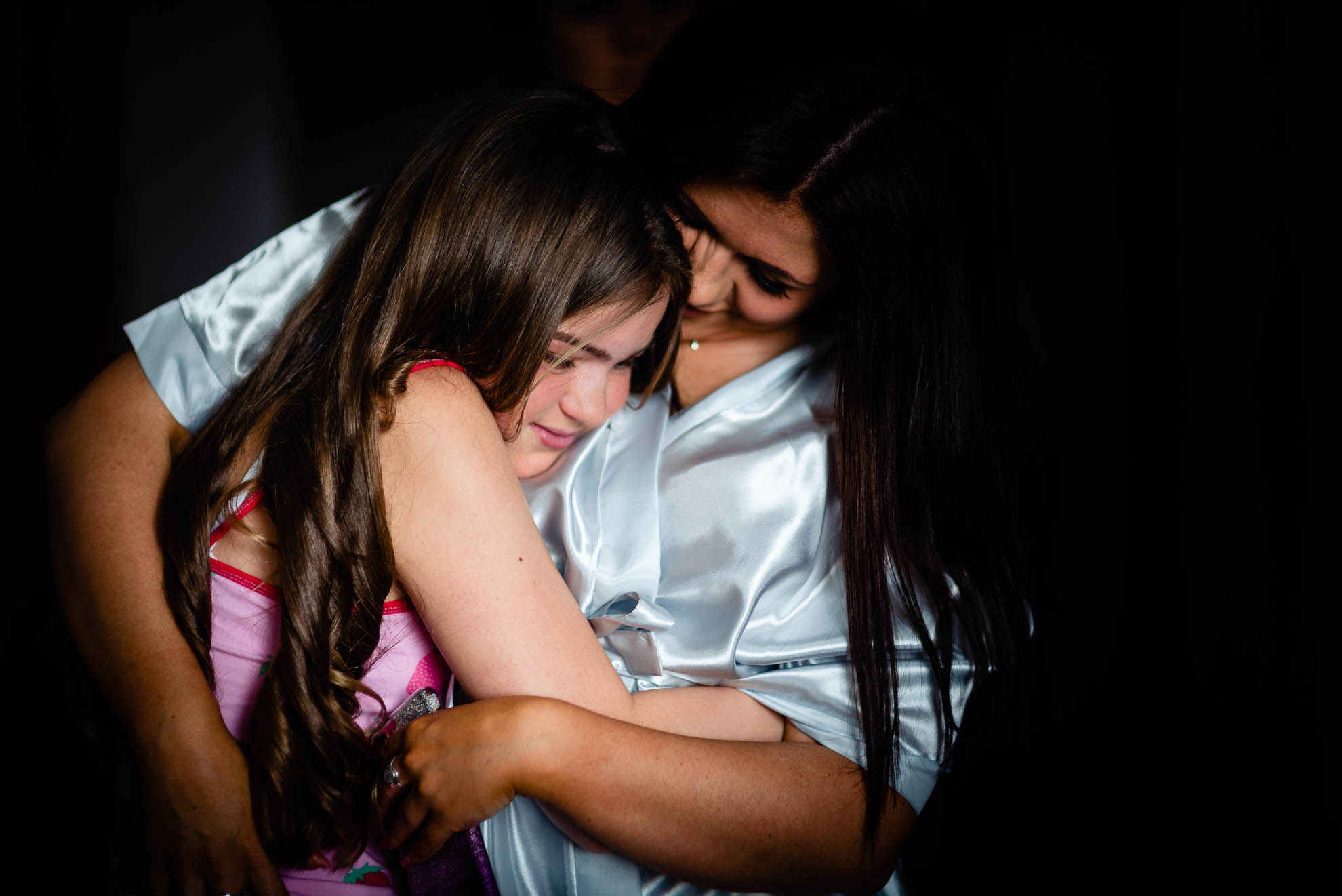Bridesmaid hugs neice
