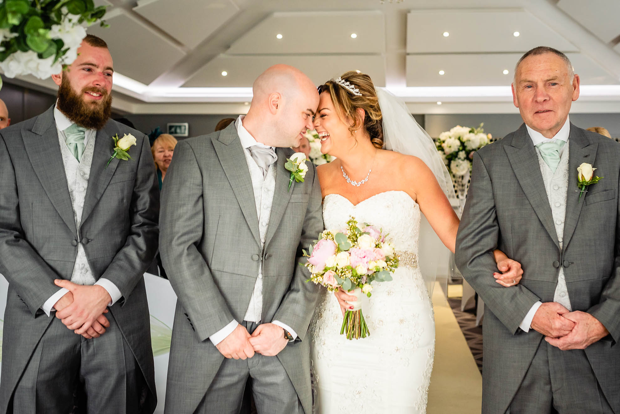 Bride and groom greet each other 