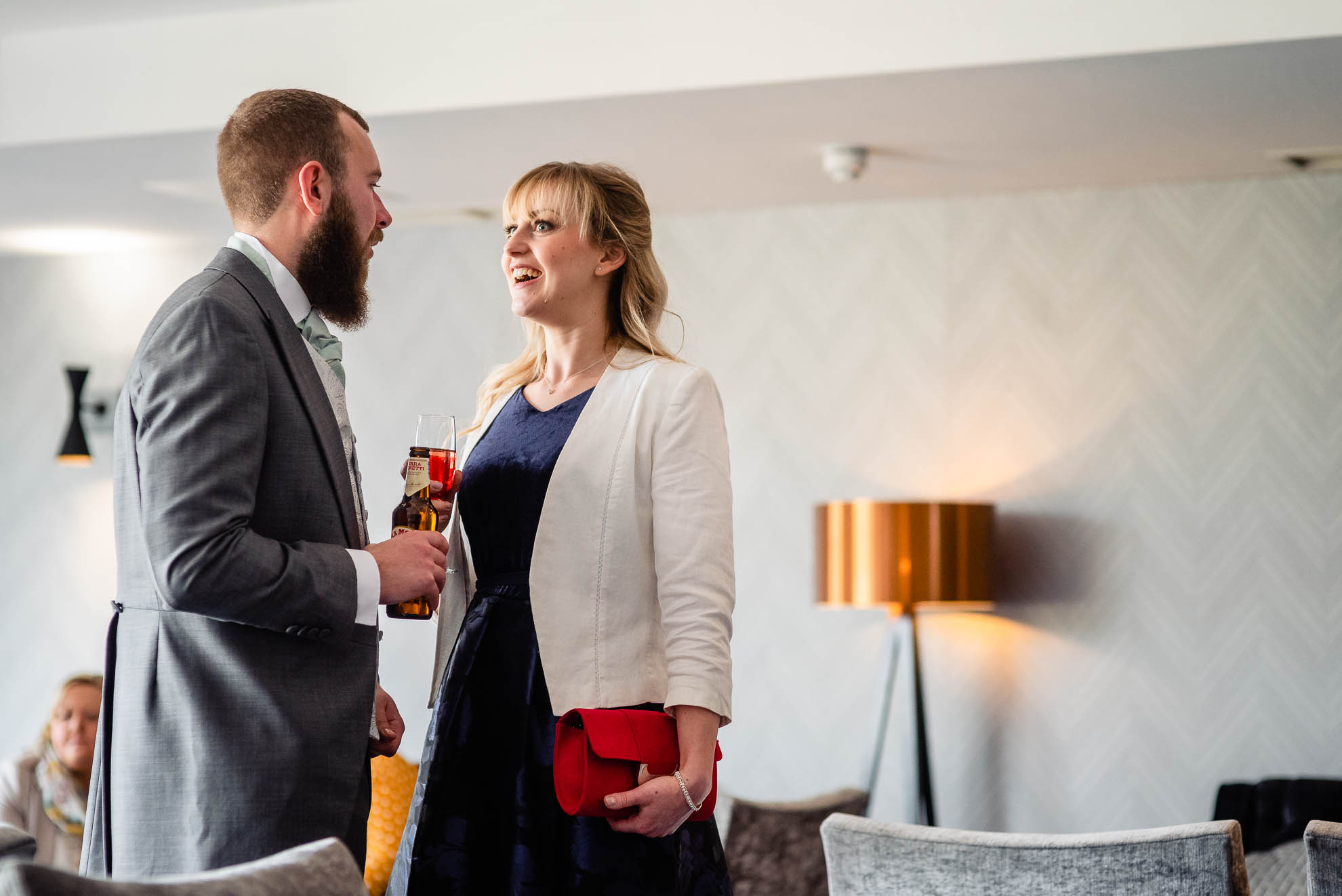 Best man and partner share a joke