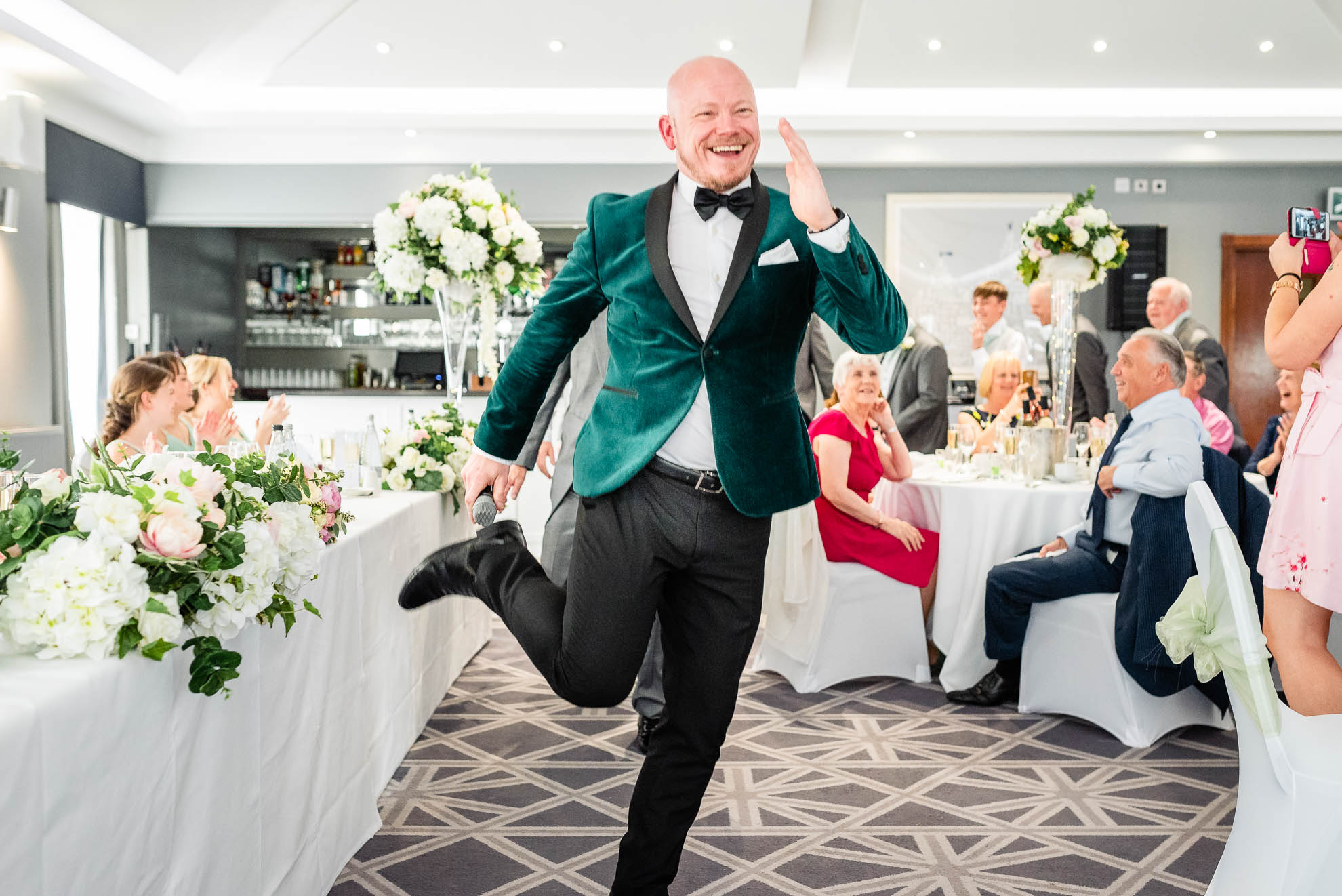 Wedding singer dances around wedding breakfast