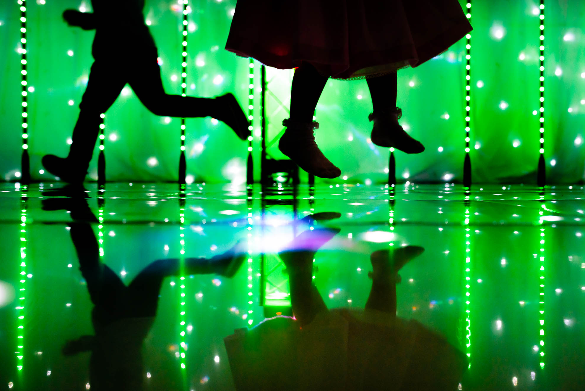 silhouette of little girls feet jumping in the air