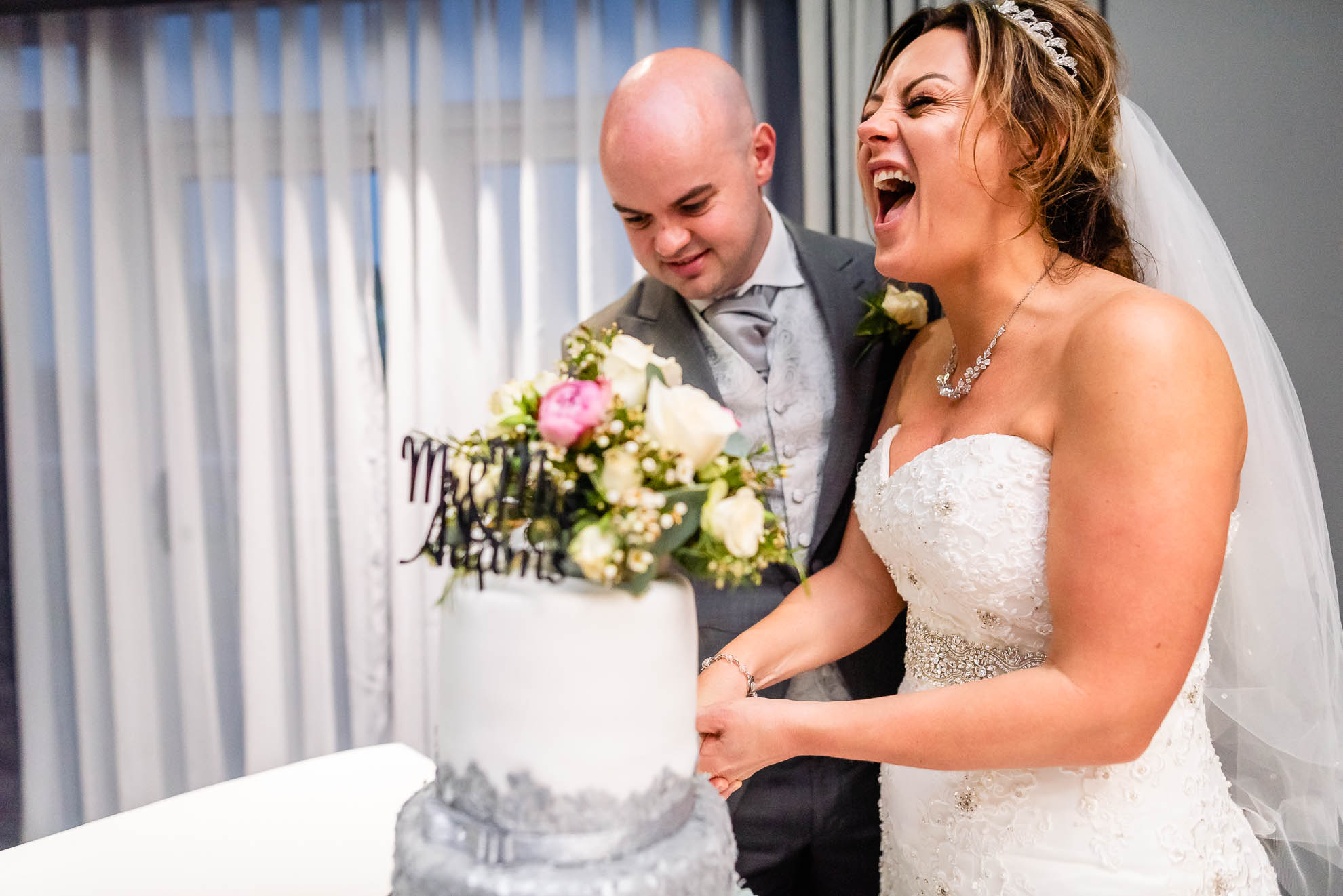 Bride and groom cut the cake