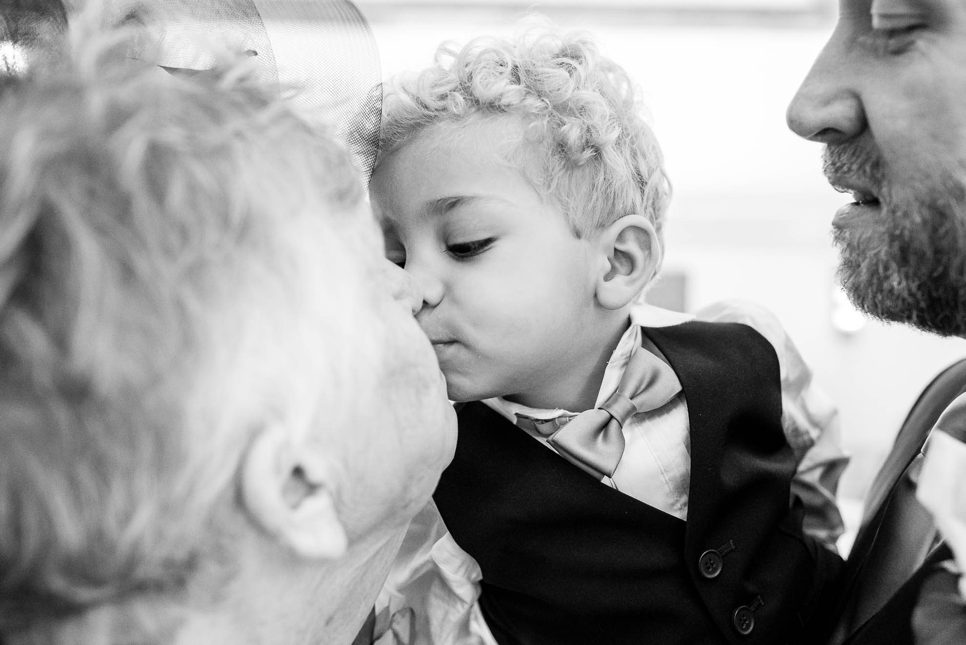 Little boy kisses grandmother