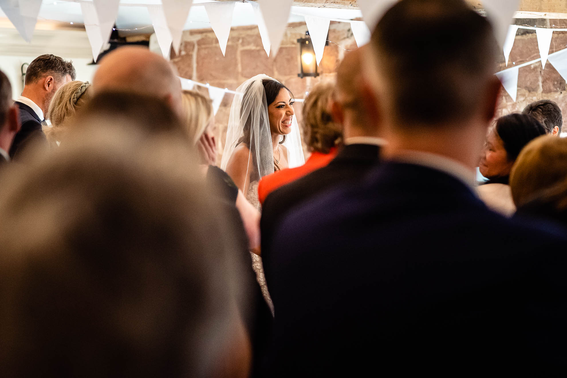 Bride laughs during the ceremony