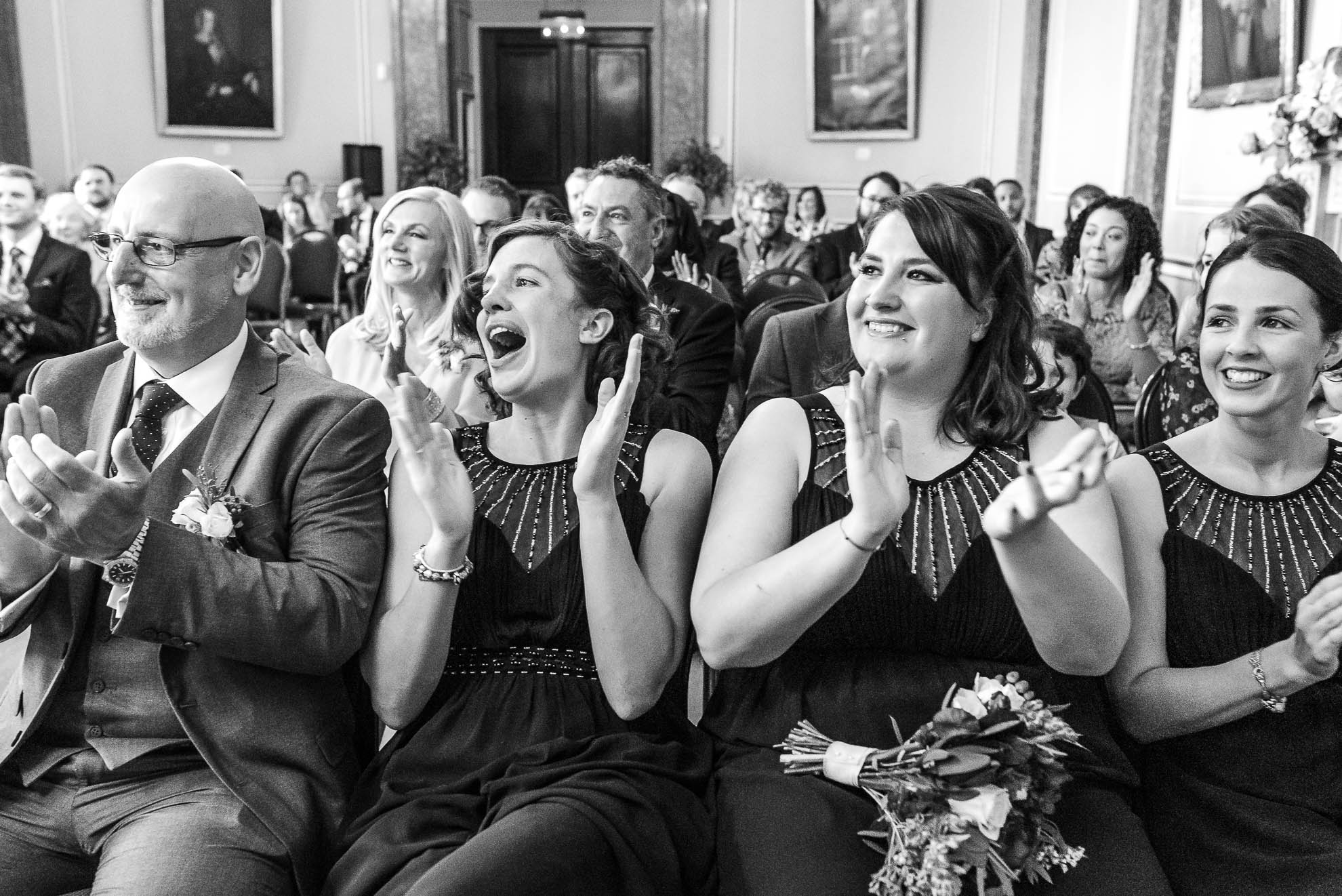 Bridesmaids cheering the happy couple