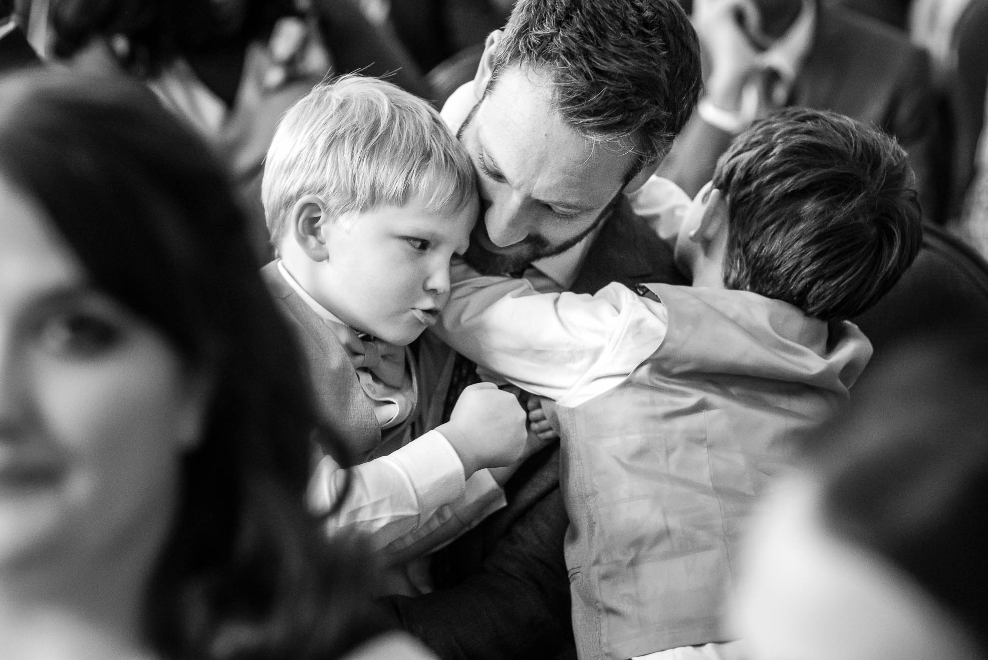 Children playing with their father