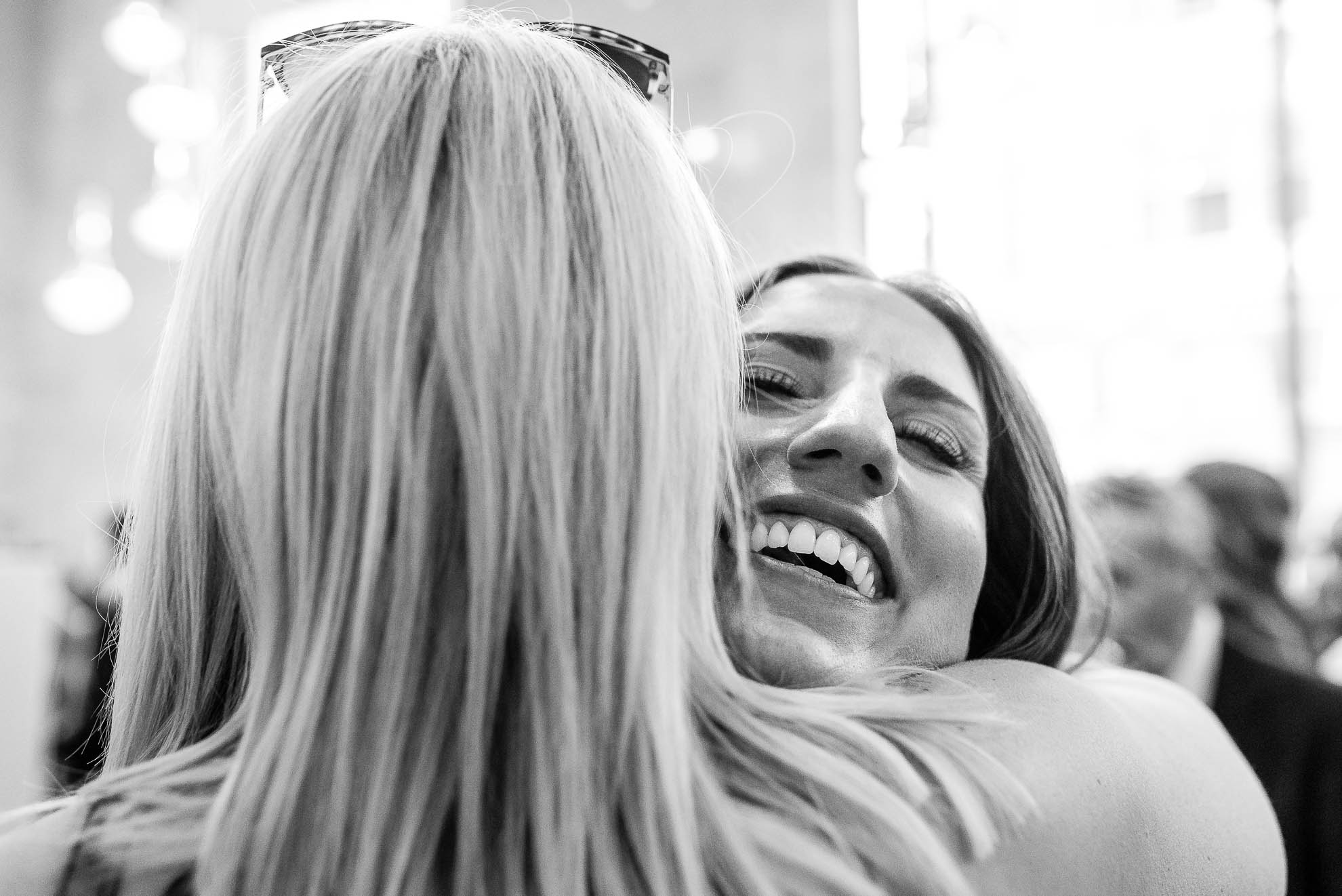Bride hugs mother