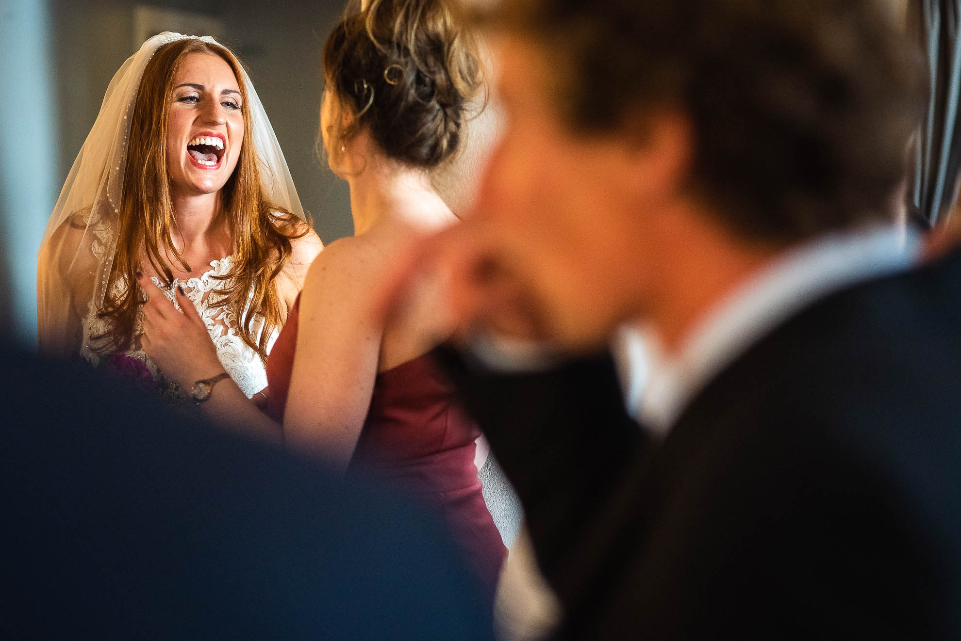 Bride shares a joke with guest