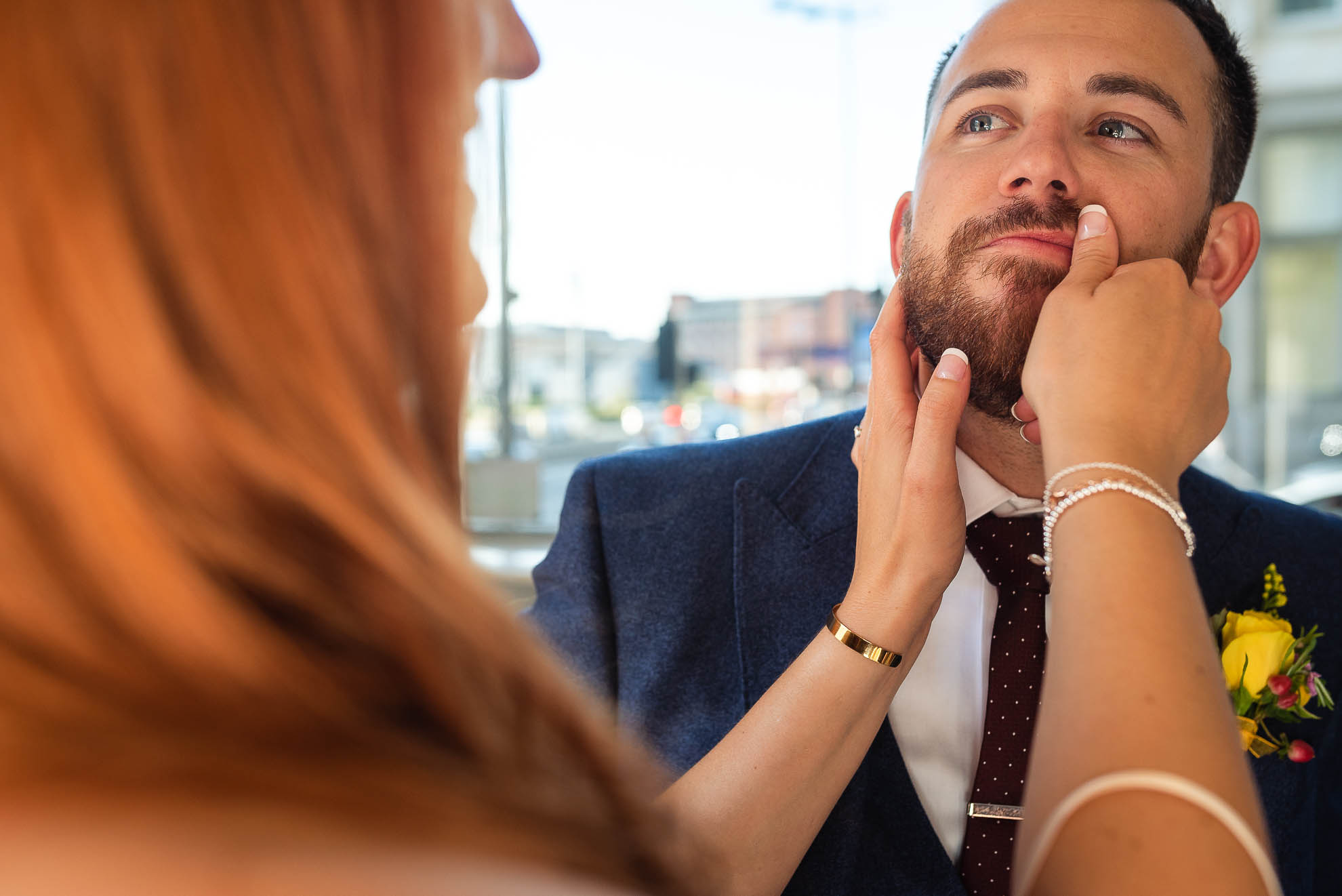 Bride wipes grooms mouth