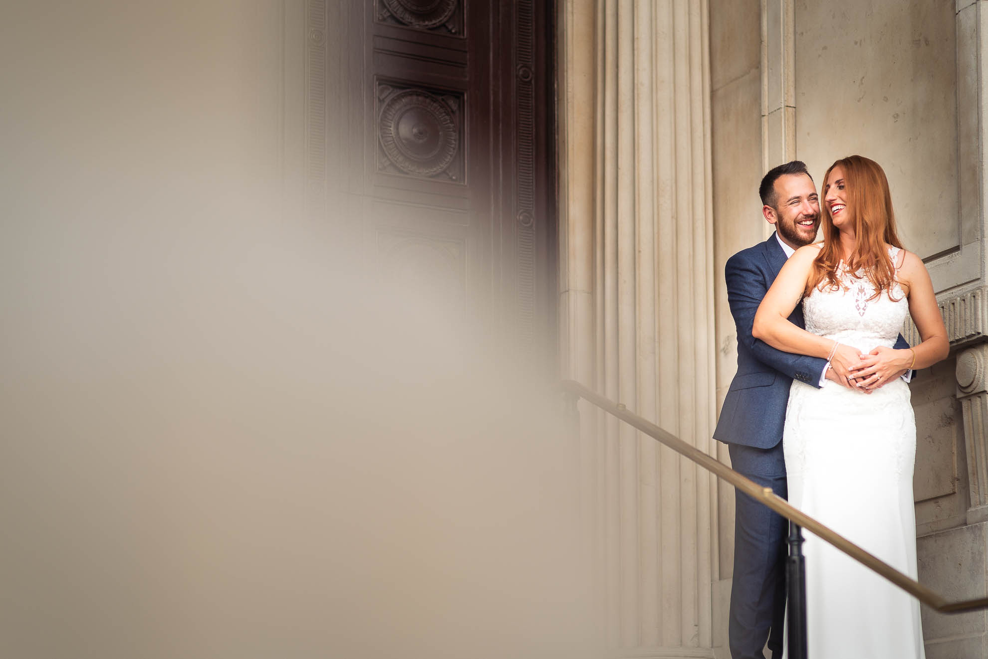 Bride and groom hold each other