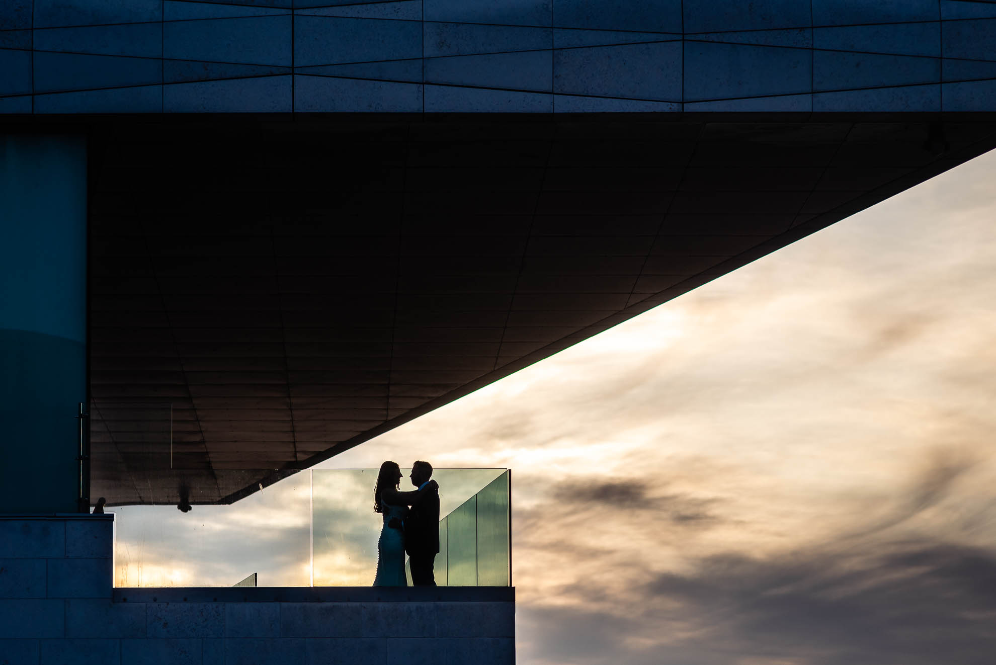 Bride and groom portrait in museum
