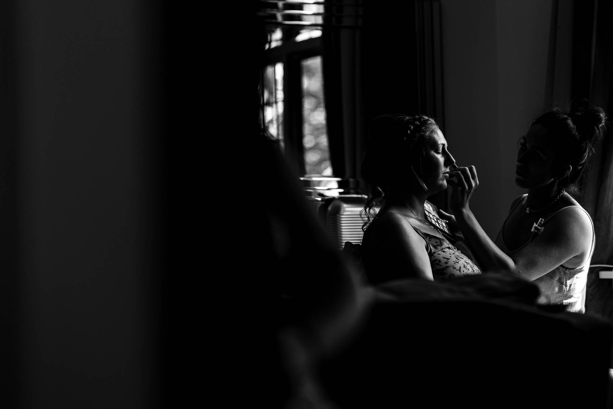 Bride having make up applied