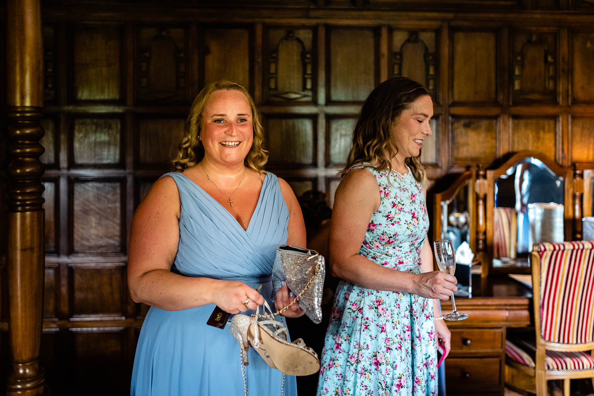 Bridesmaid shares a joke with the bride