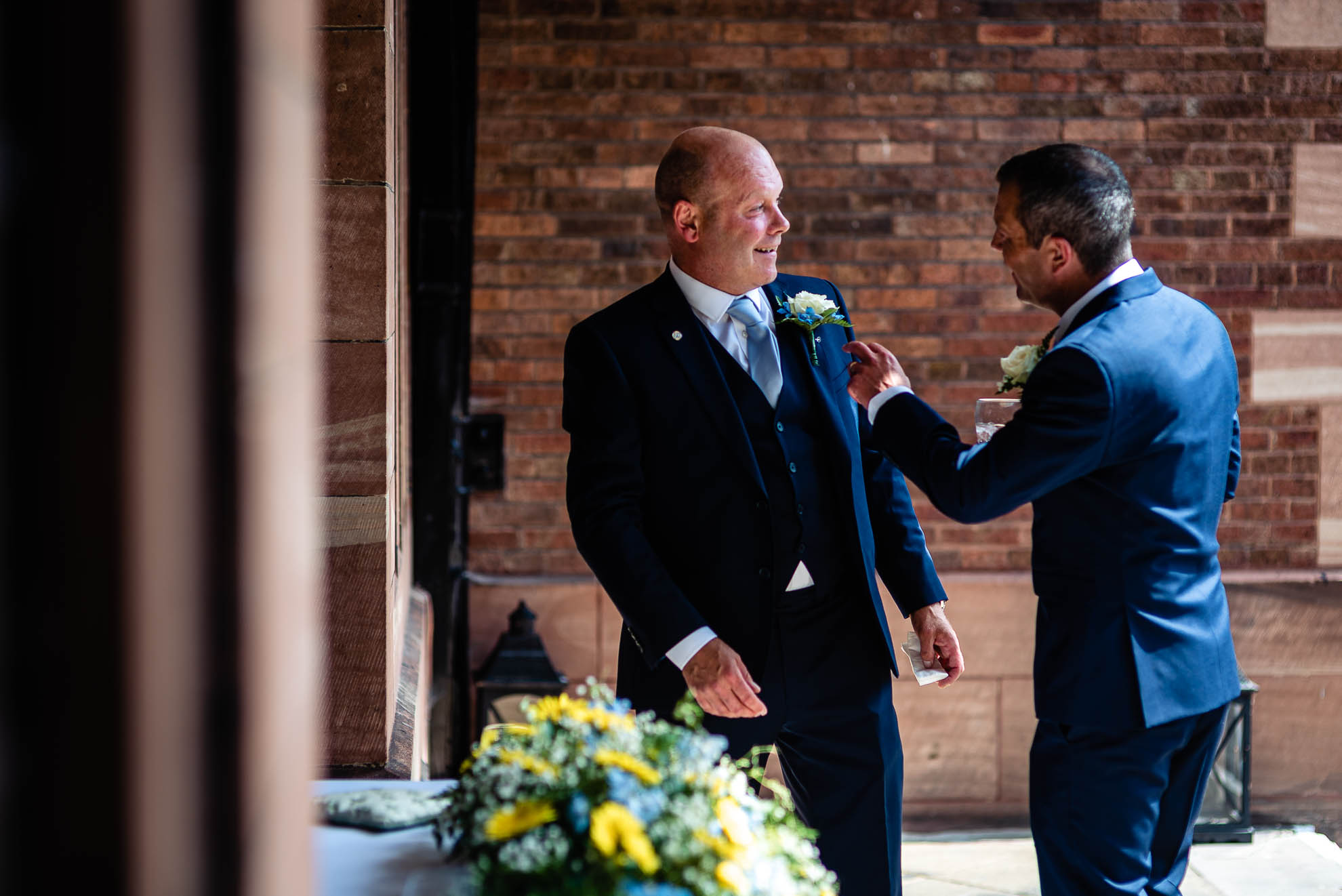 Groom shares a joke with best man