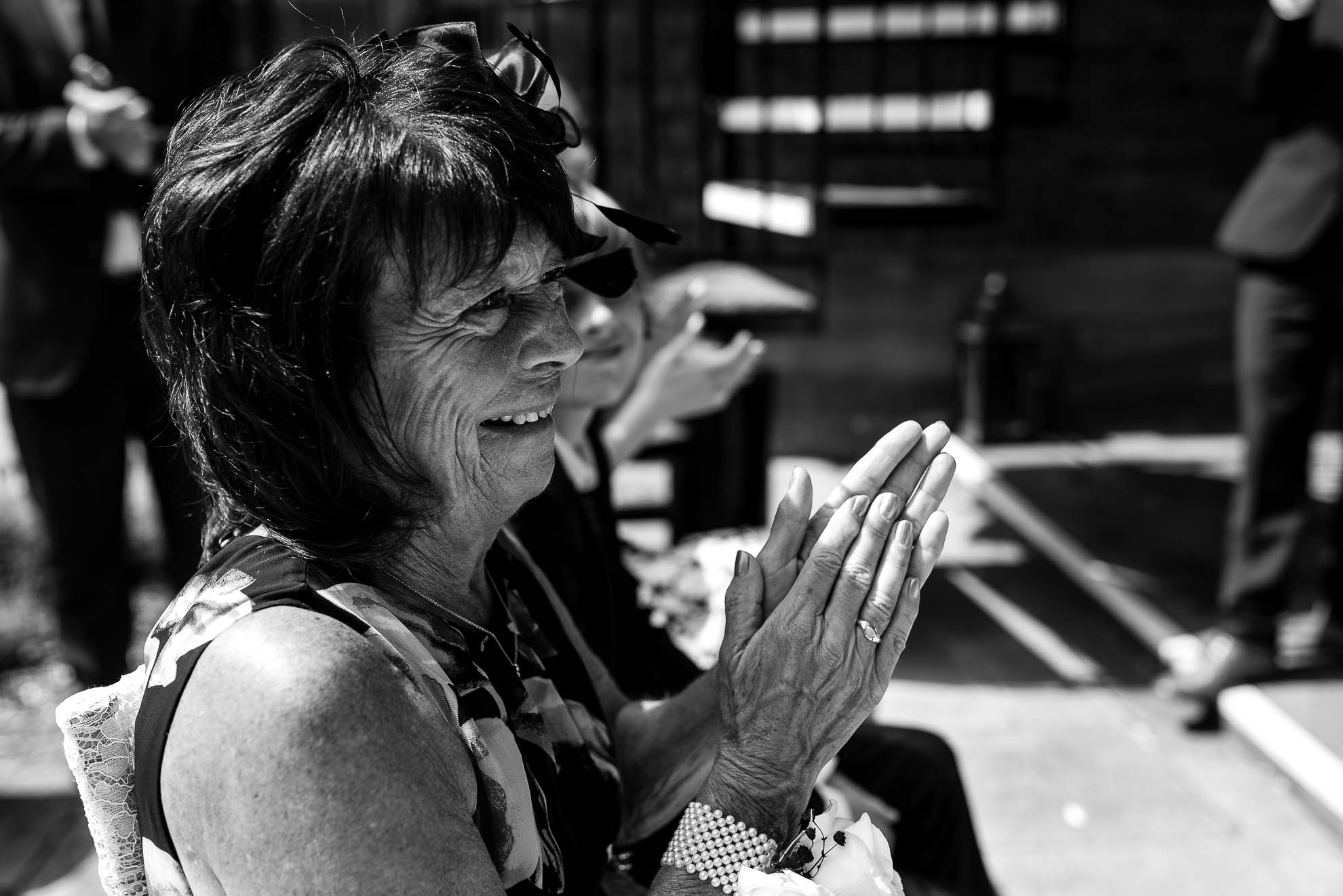 Mother of the groom congratulates the newlyweds