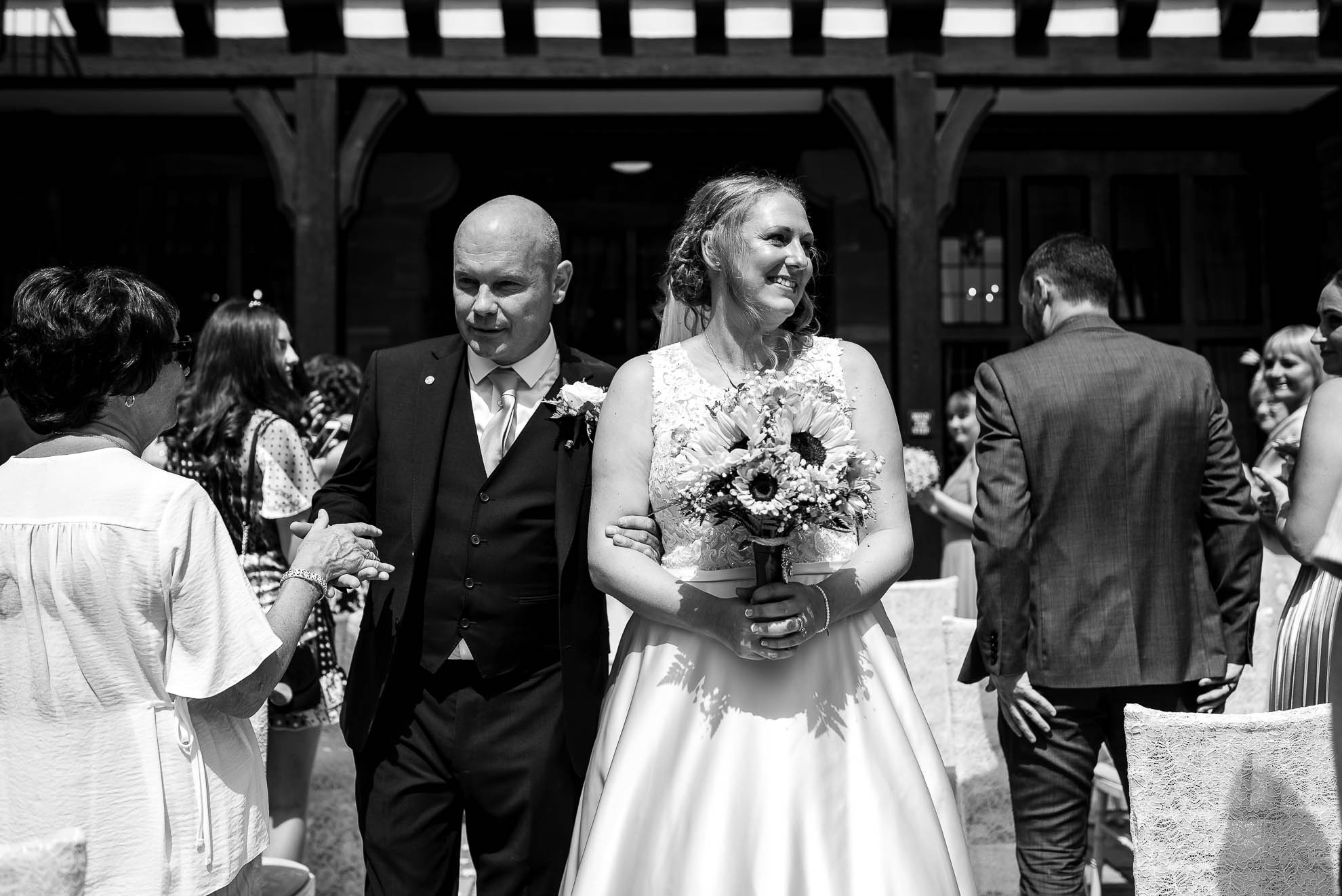 Bride and groom walk back down the aisle