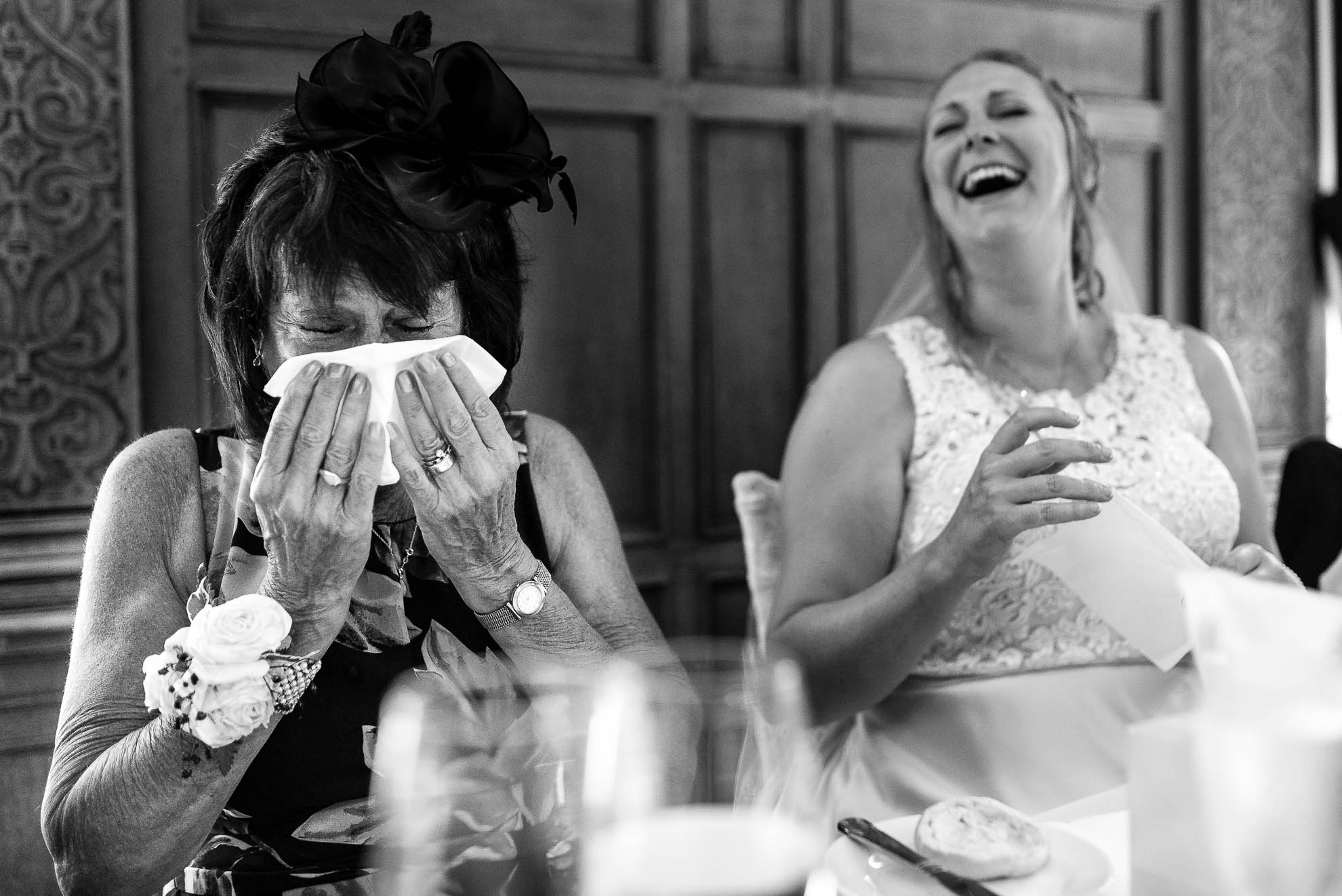 Mother of the bride wiping away tears