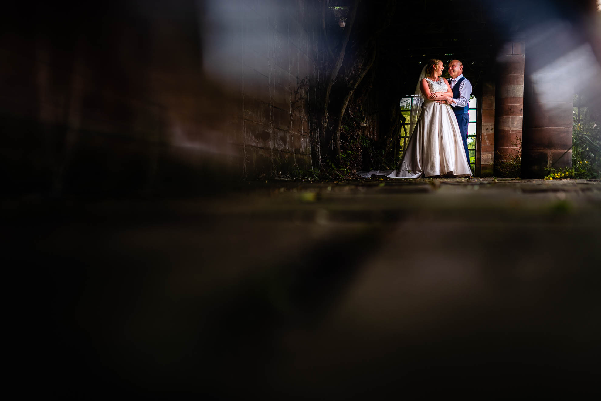 Bride and groom wide shot portrait