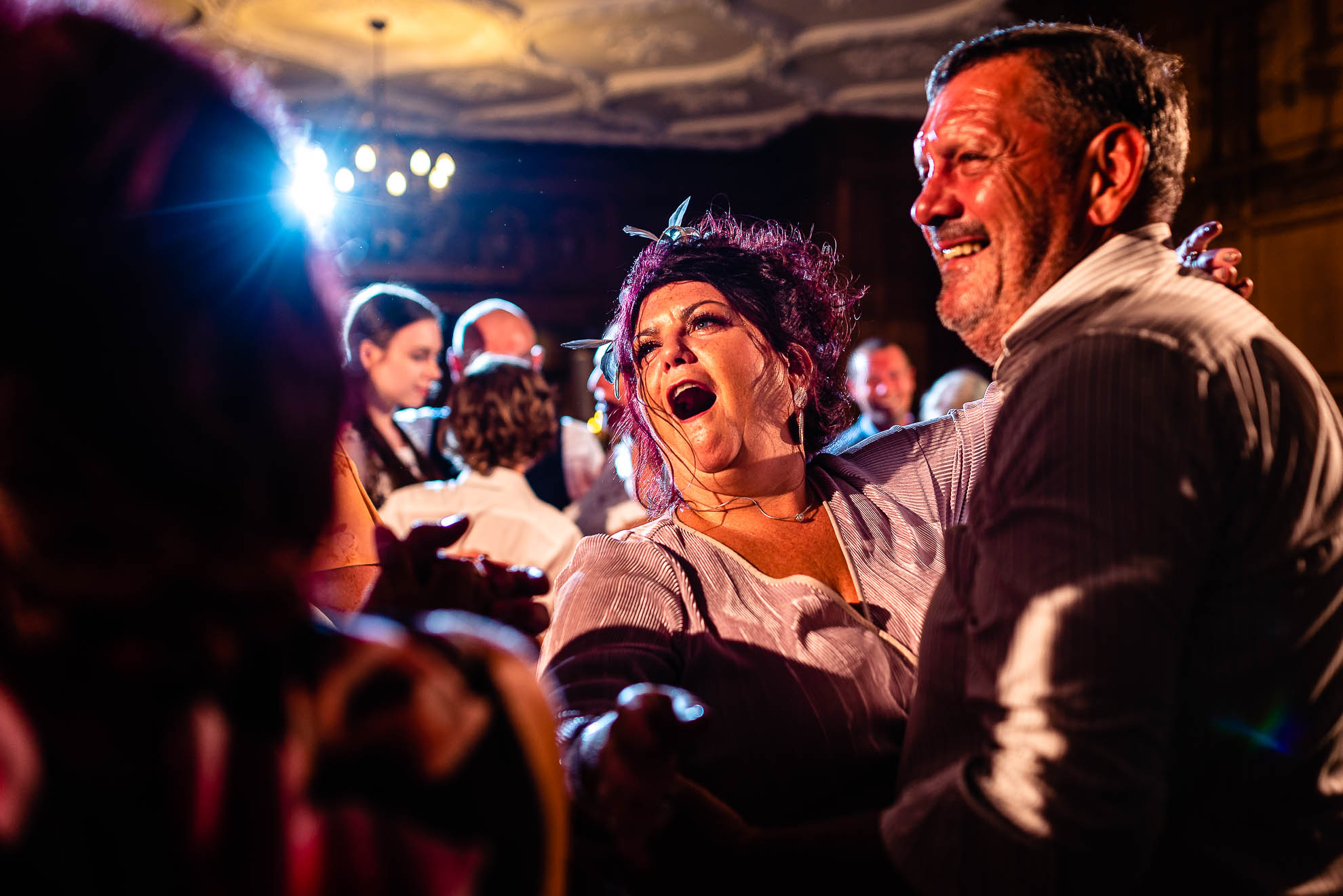 Wedding guests having fun on dance floor