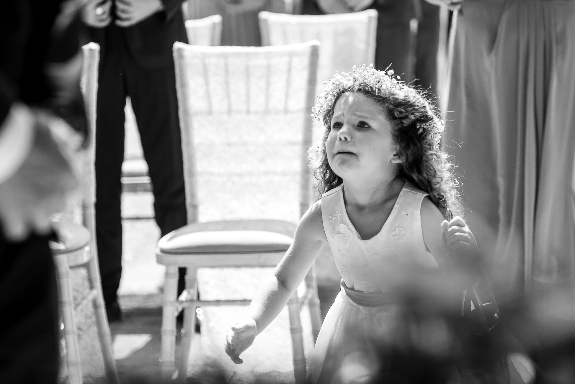 Flower girl runs to her father the best man