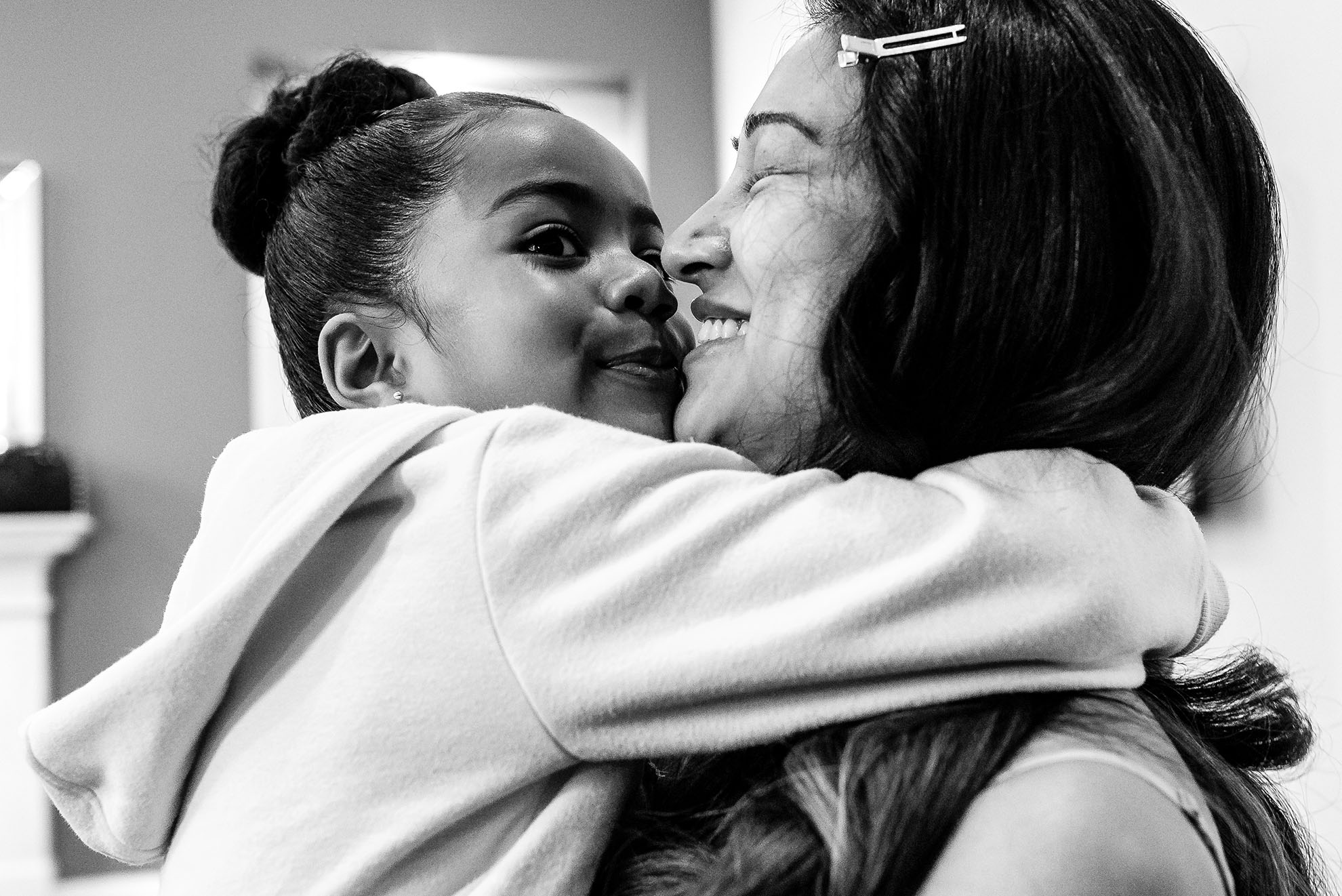 Bride gets a big hug from her daughter