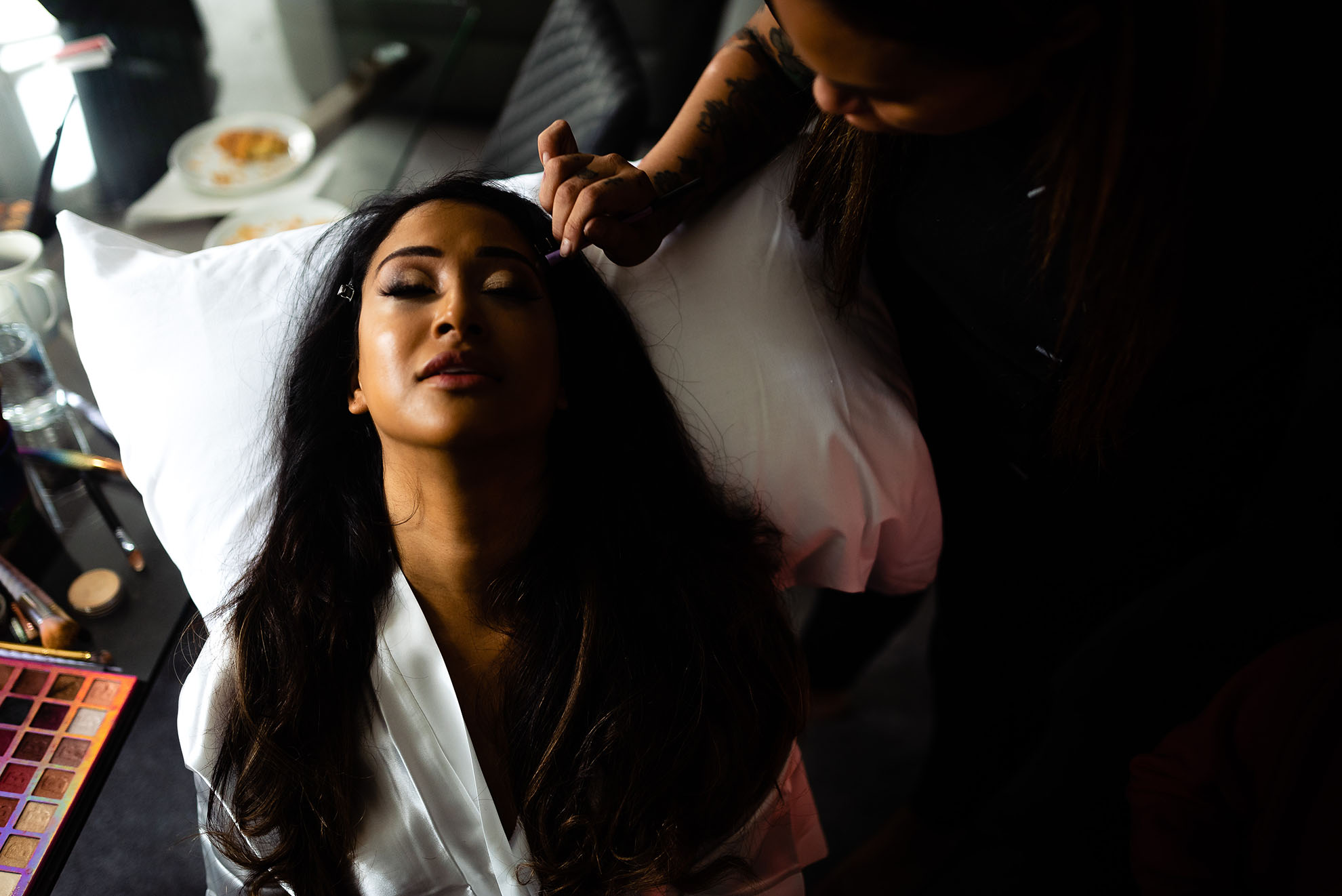 Bride having her make up applied