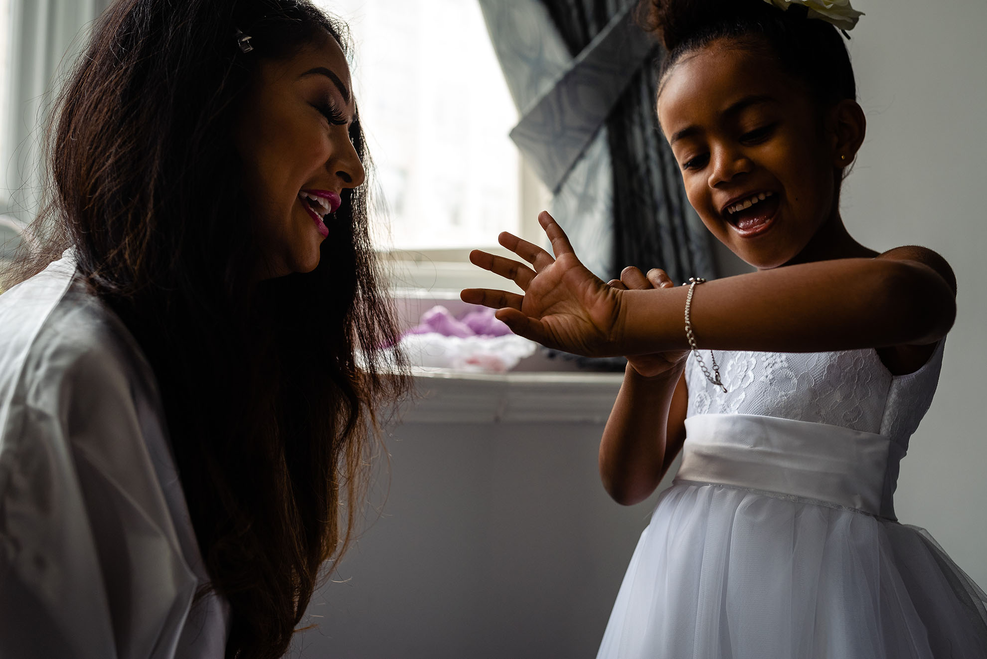 Brides daughter is overjoyed with her wedding present bracelet