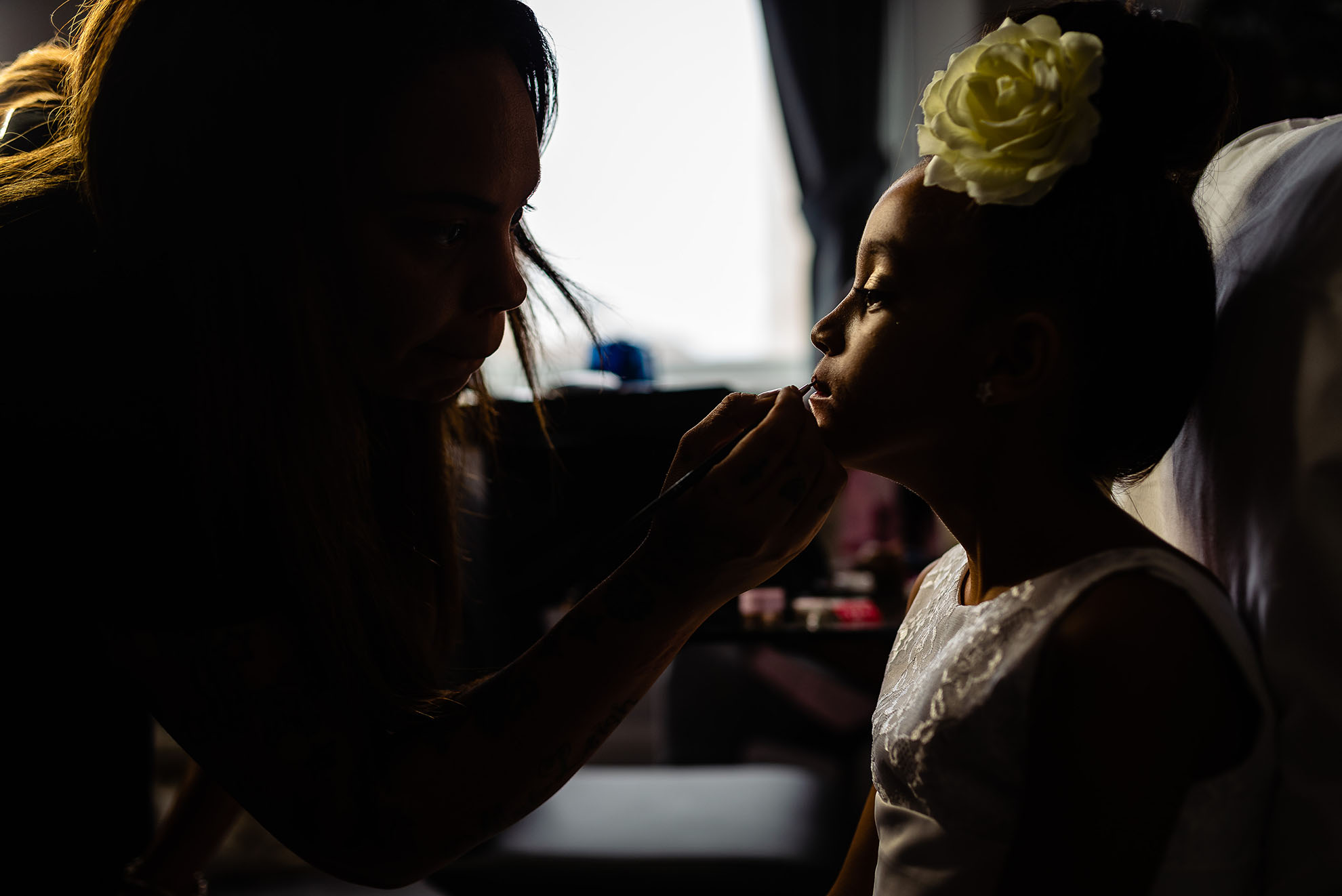 Flower girl has make up applied
