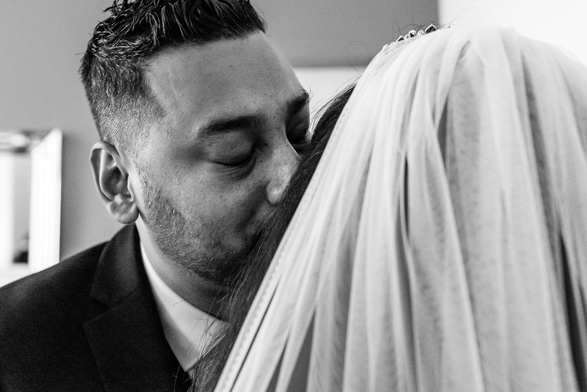 Brides brother gives her a kiss