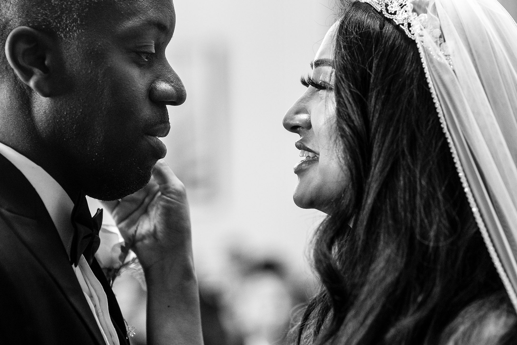 Bride and groom look into each others eyes after the wedding ceremony