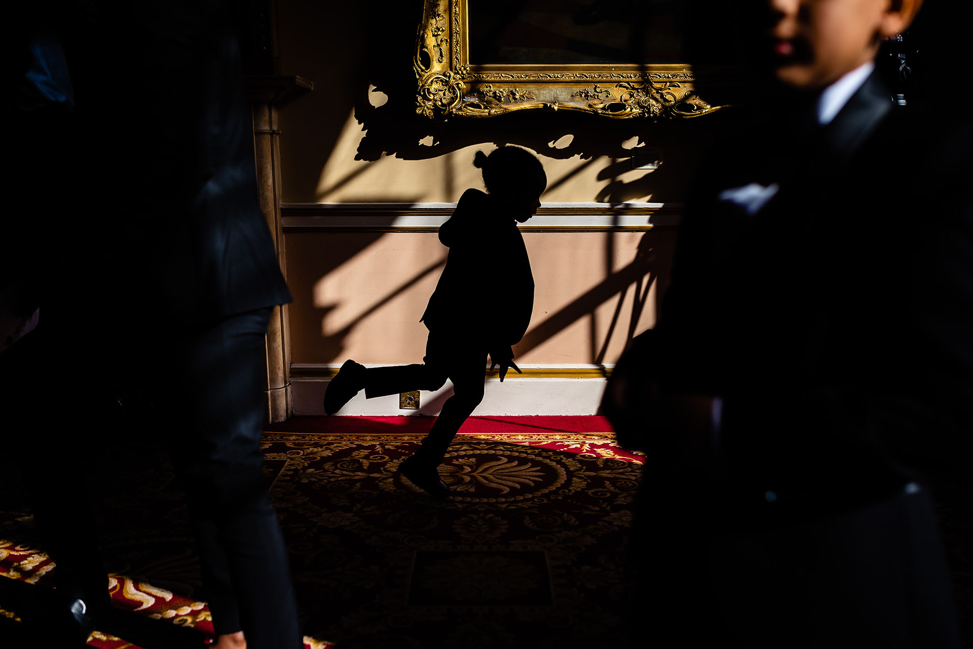 Silhouette of little boy running