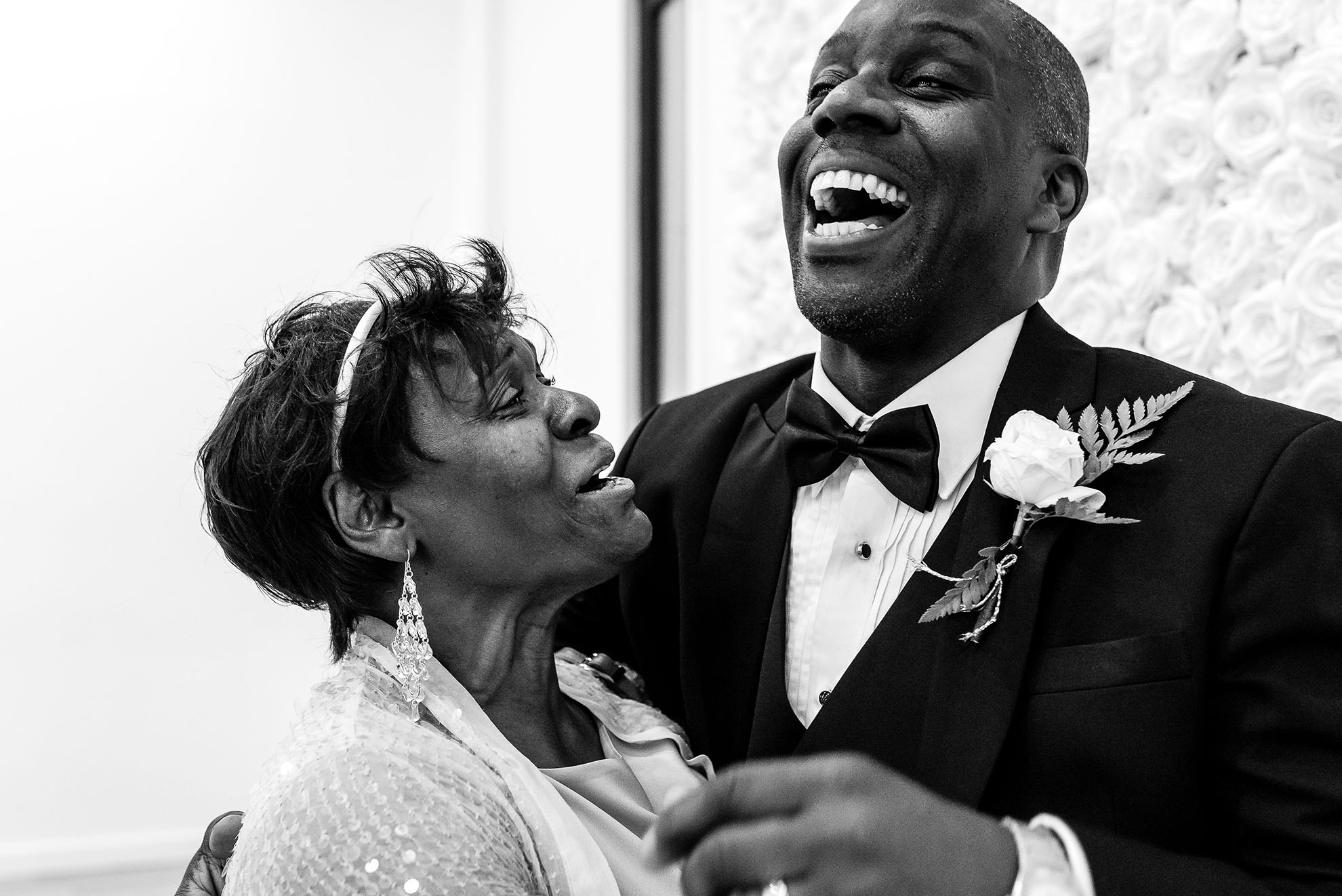 Groom shares a a joke with guest