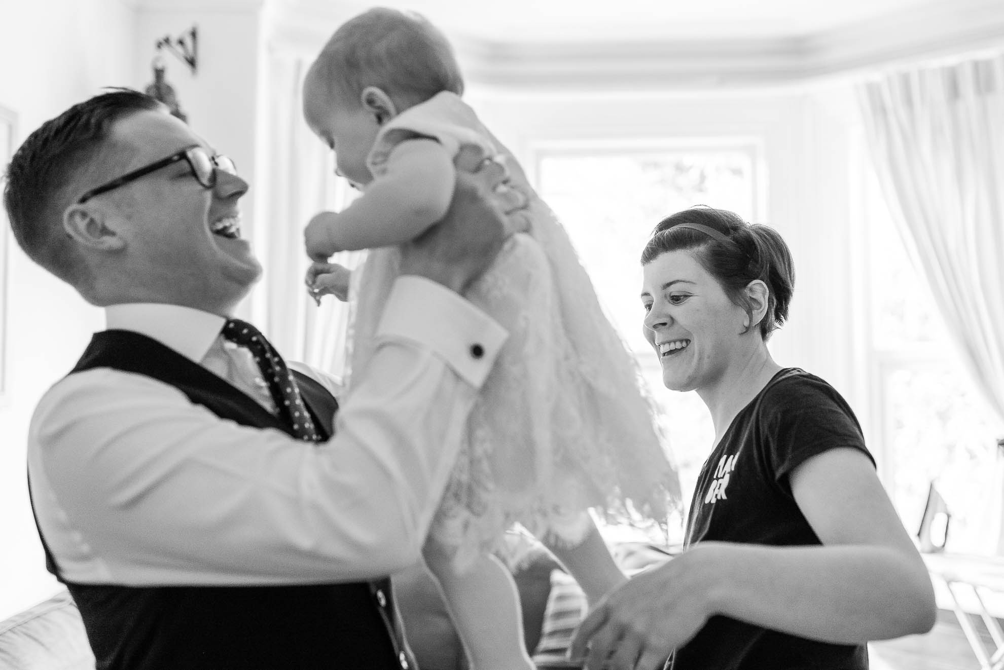 Bride and groom with their little girl