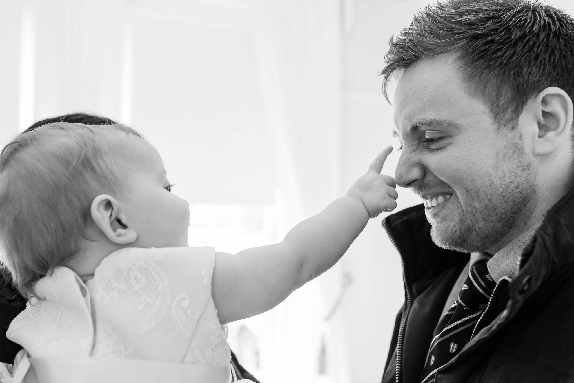 Little girl plays with best man