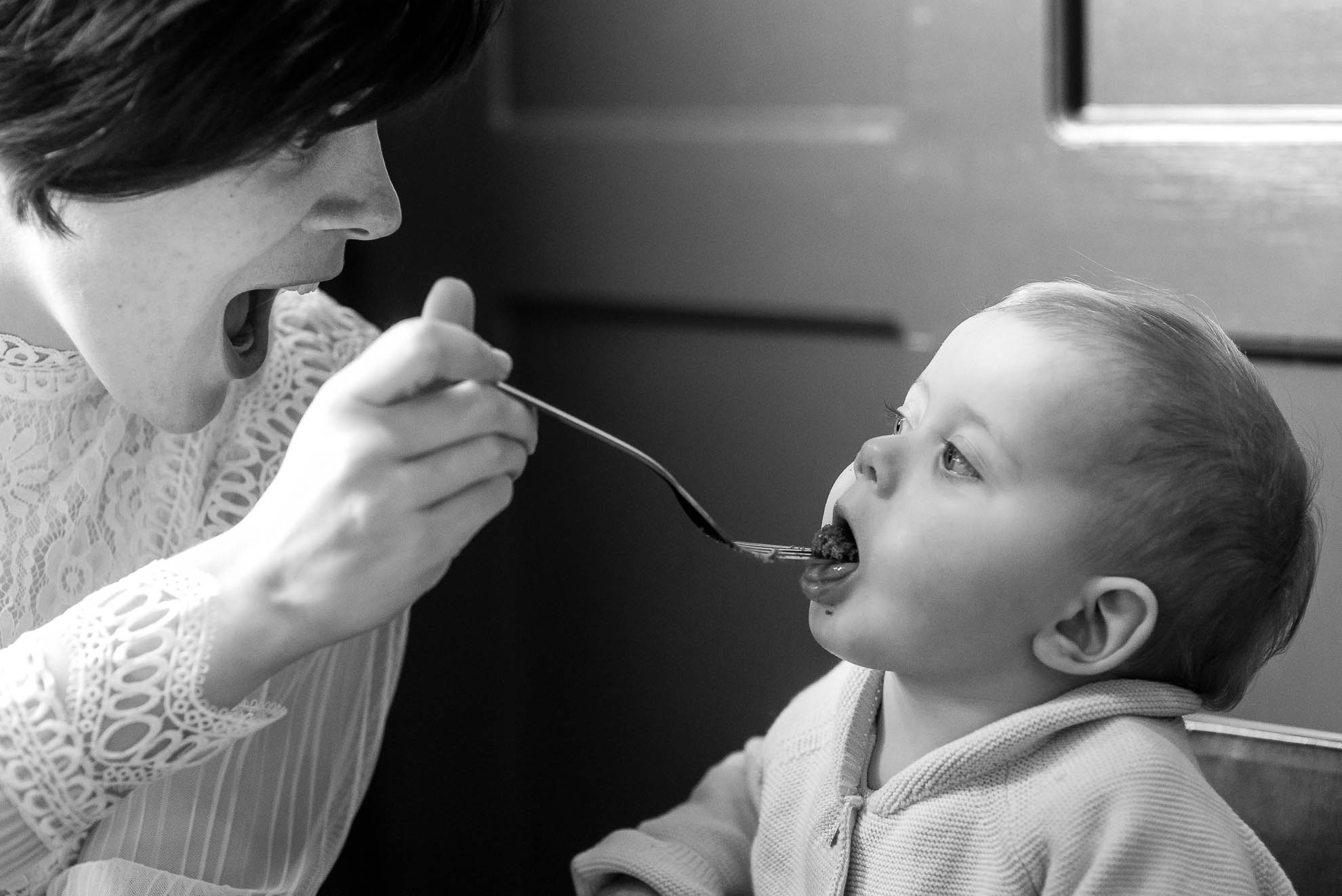 Bride feeds little girl