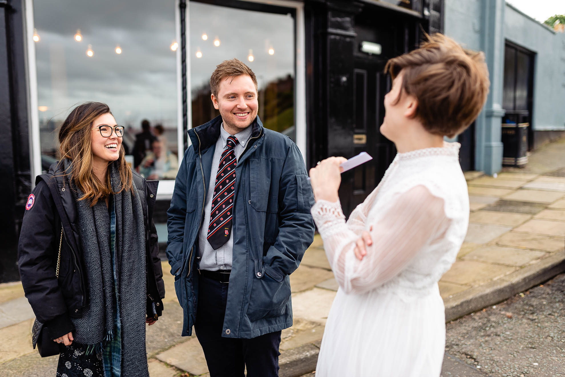 witnesses share a joke with bride