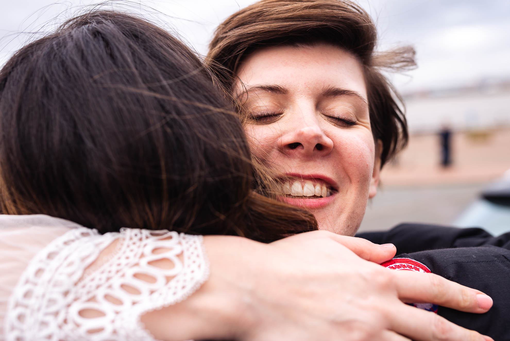 Bride hugs wedding guest