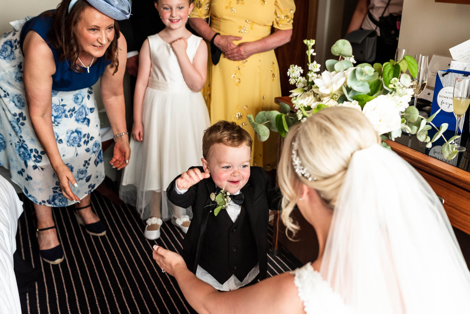 Brides son gives her a hug