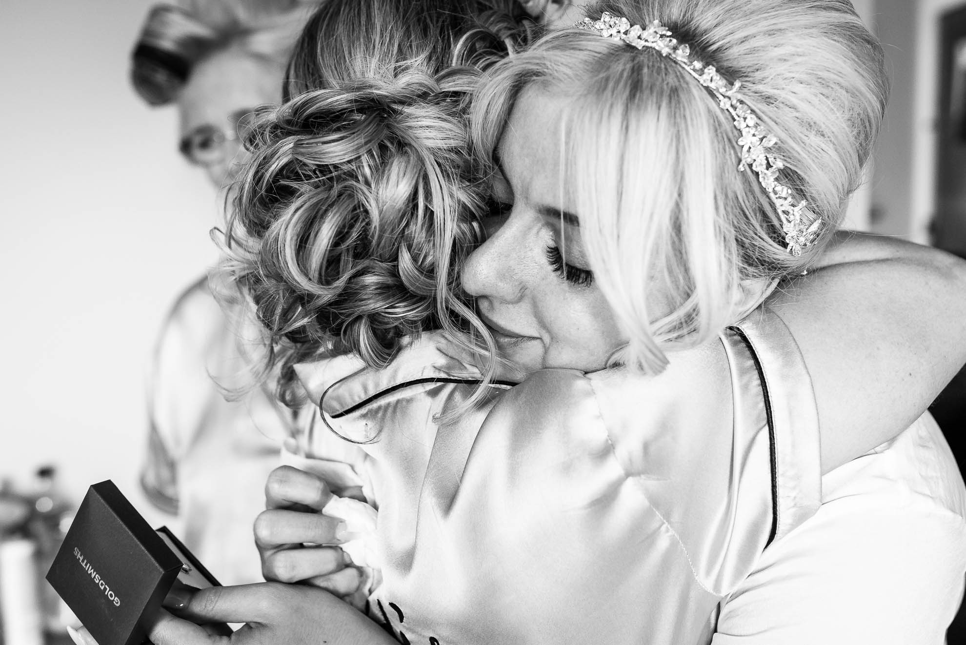 Bride gives her sister a hug