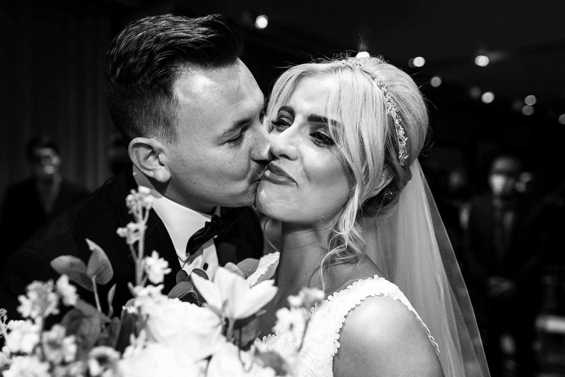 Groom kisses bride