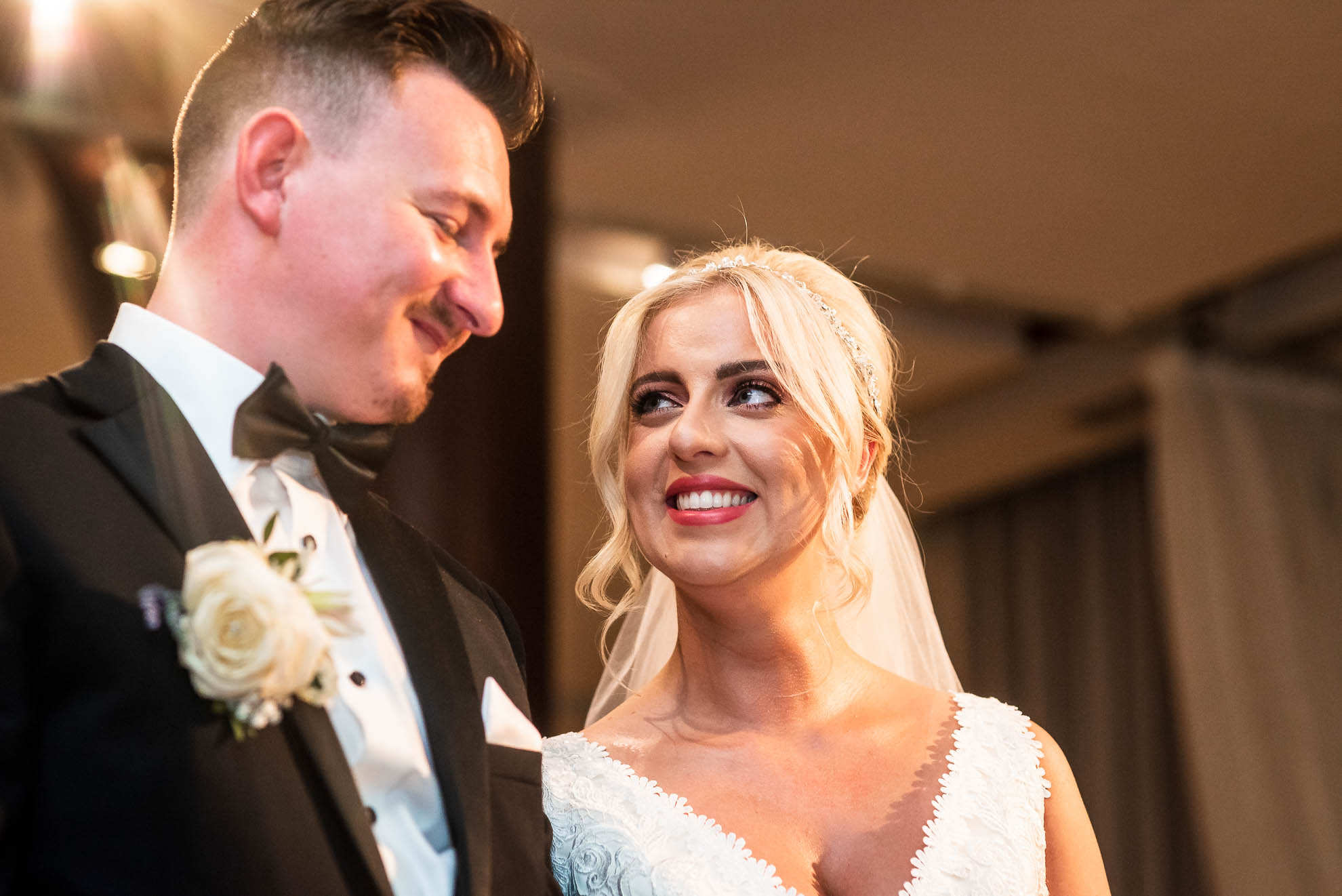 Bride smiles at groom