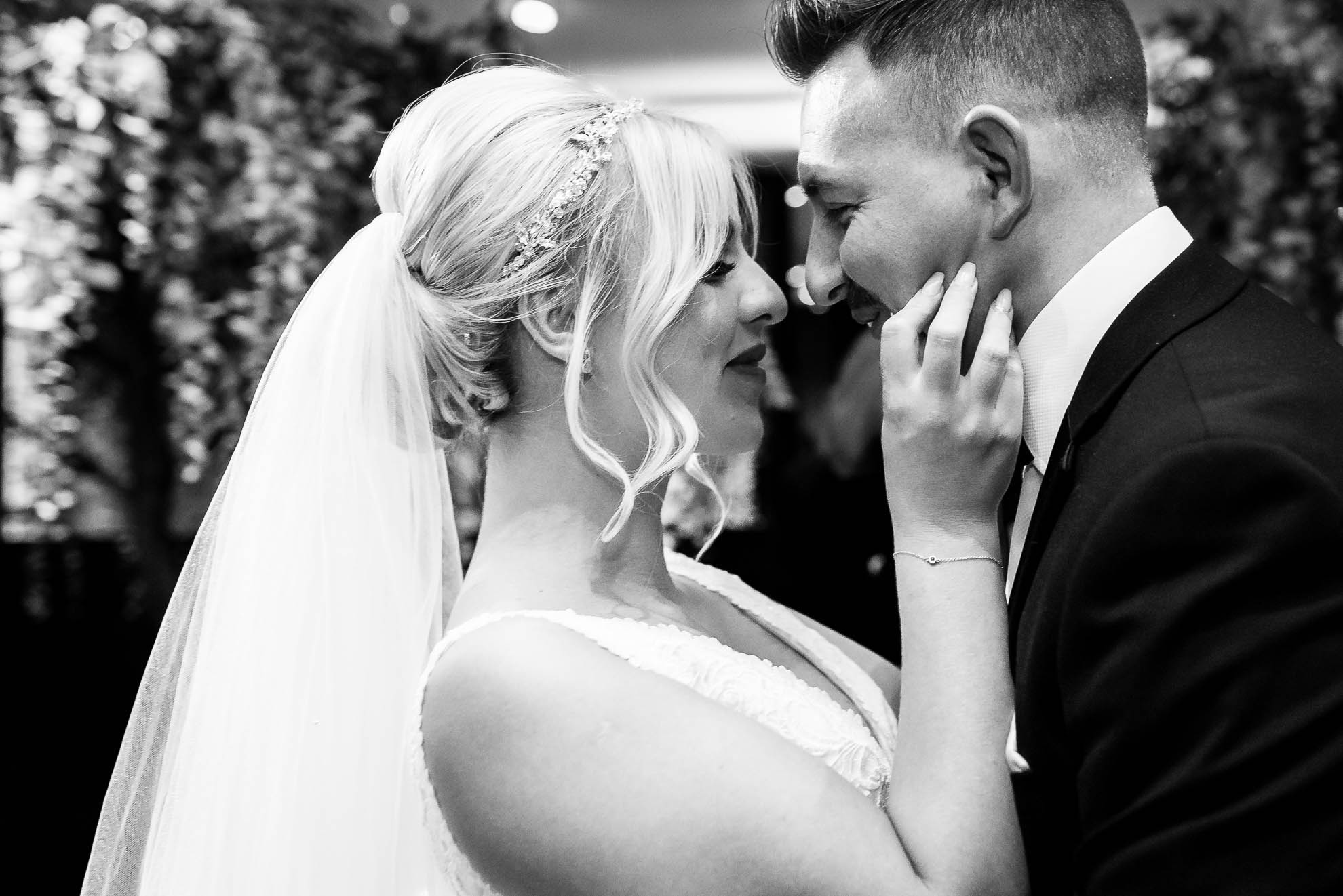 Bride and groom hold each other 