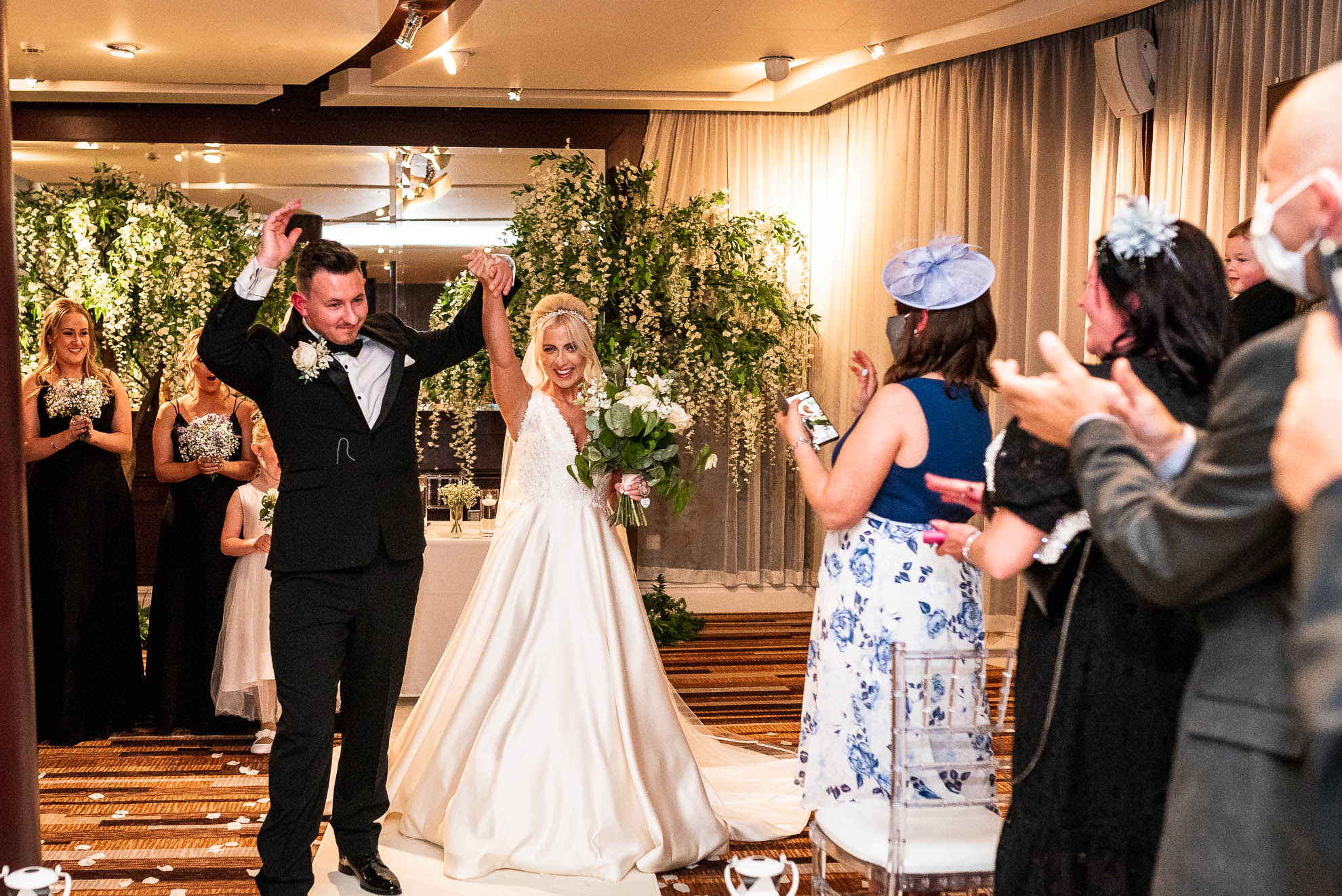 Bride and groom walk back down the aisle